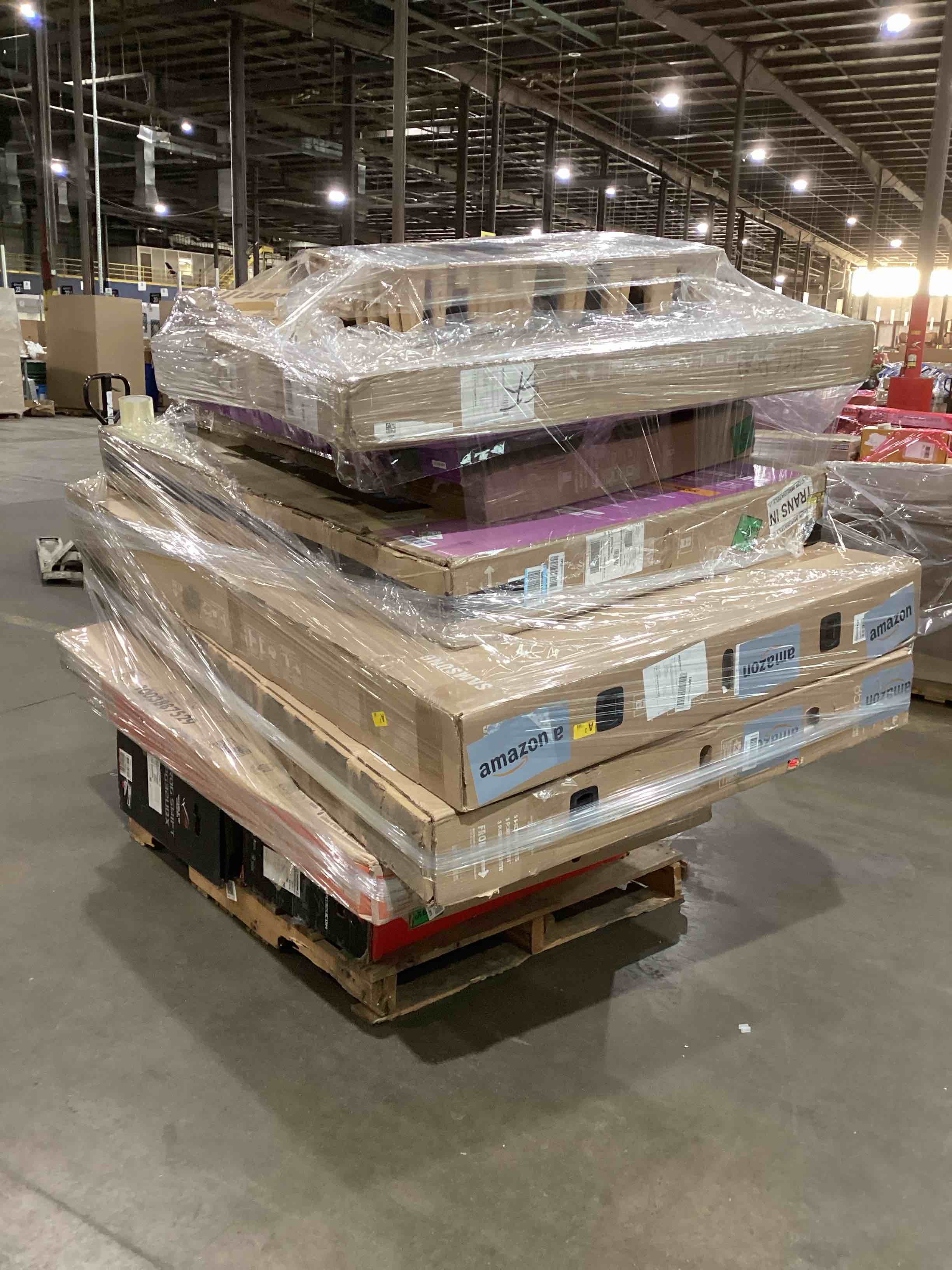 pallet of broken tv and monitors 