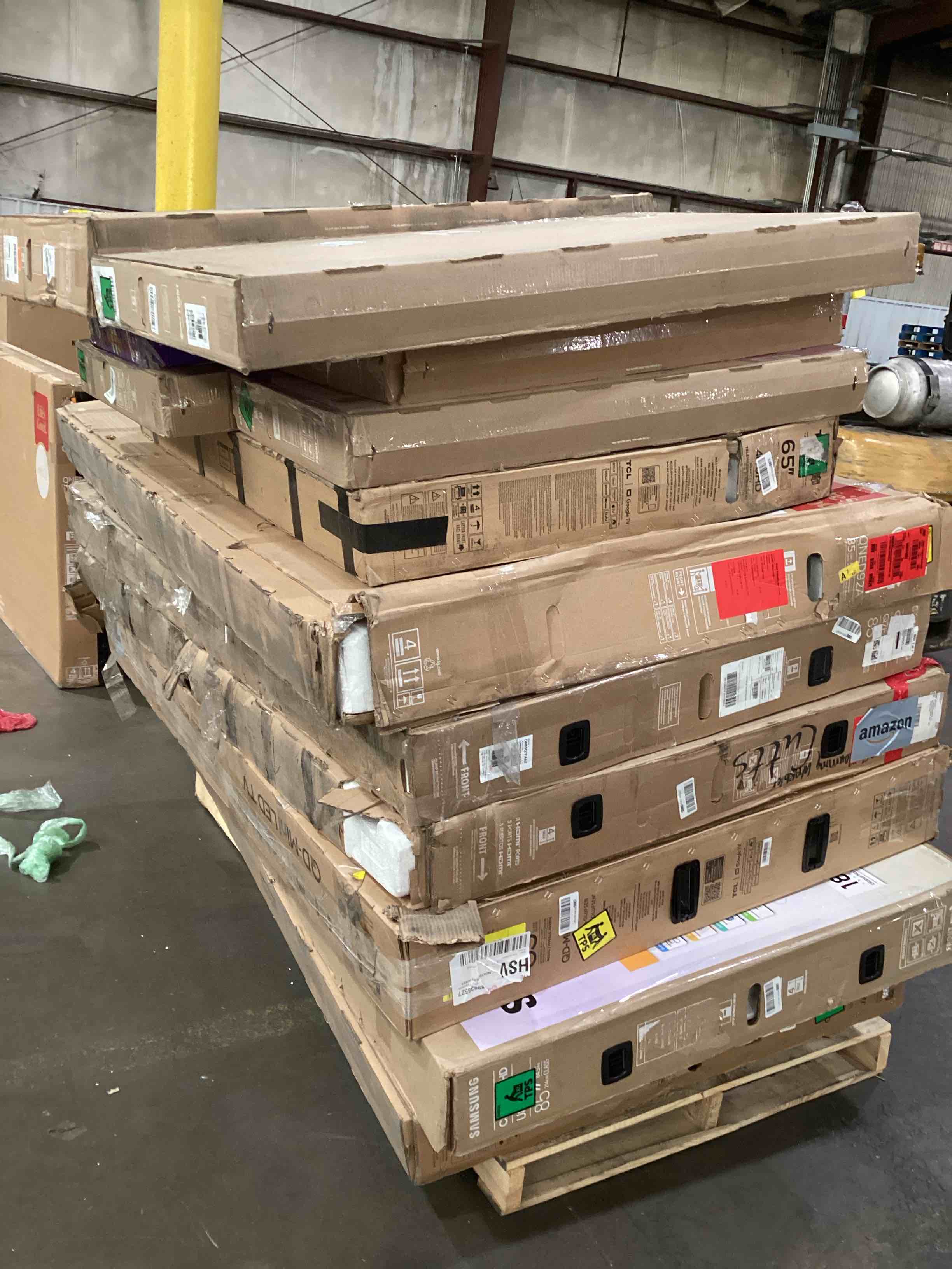 pallet of broken TVs 