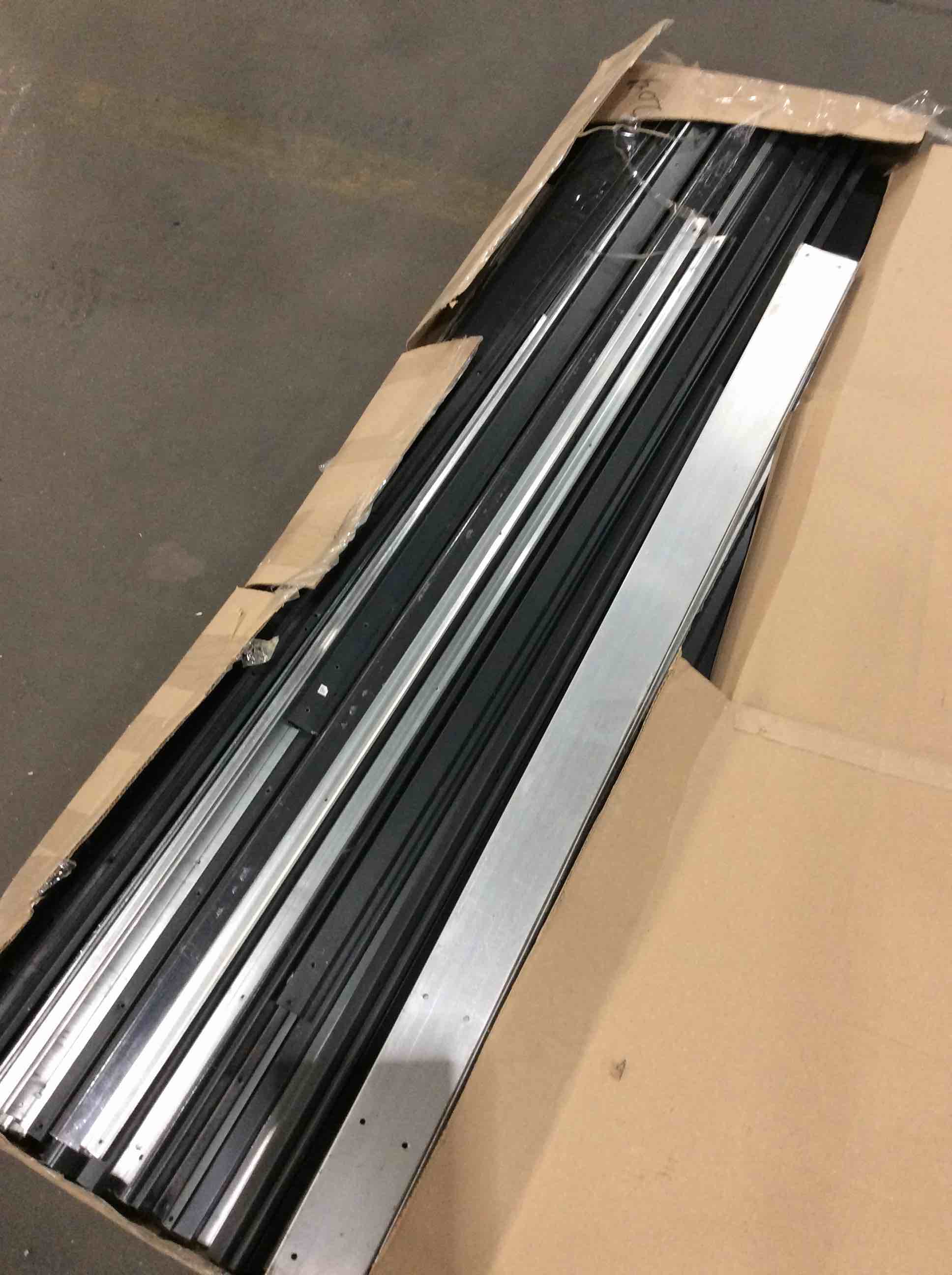 pile of L brackets, metal sheets and bars.