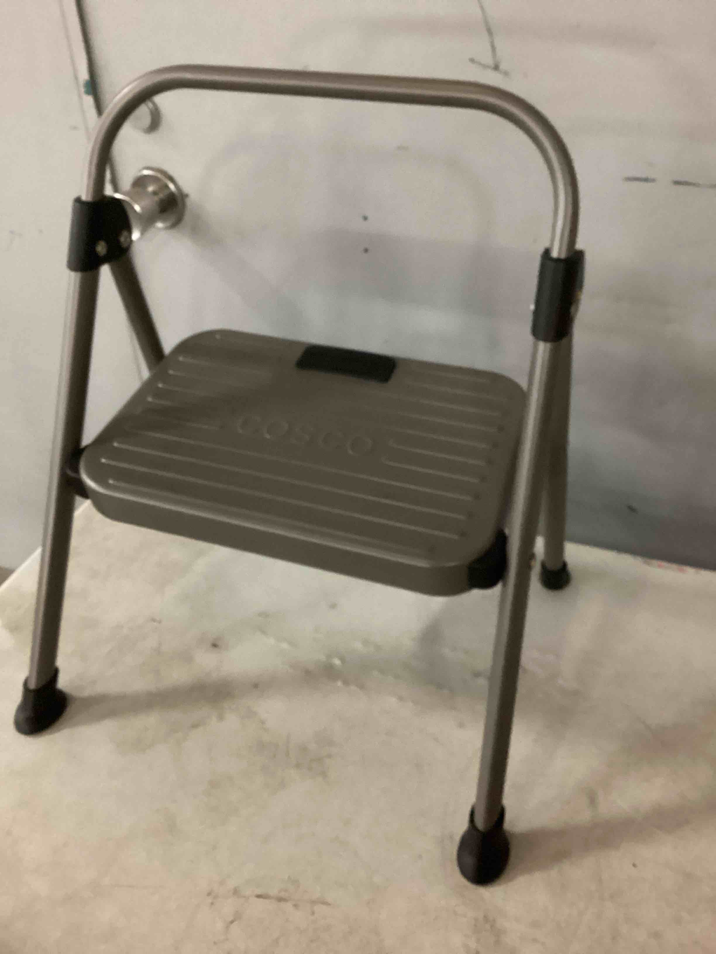 Condition photo showing As Is for cosco 2 step all steel step stool