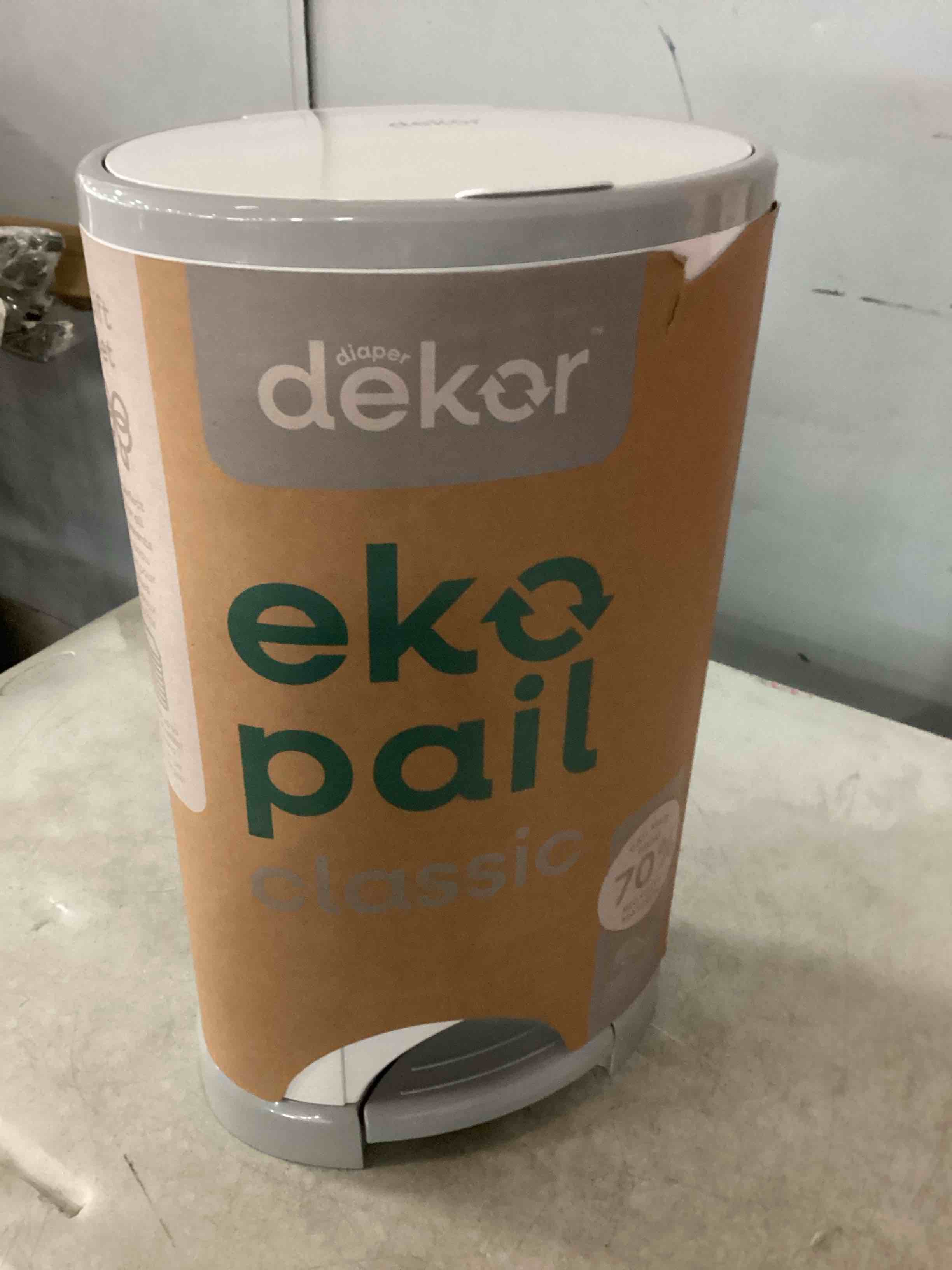 Condition photo showing As Is for diaper dekor eko classic diaper pail gift set, white only eco-friendly diaper pail made with 70% recycled materials comes with up to a year's supply worth of diaper dekor refills!