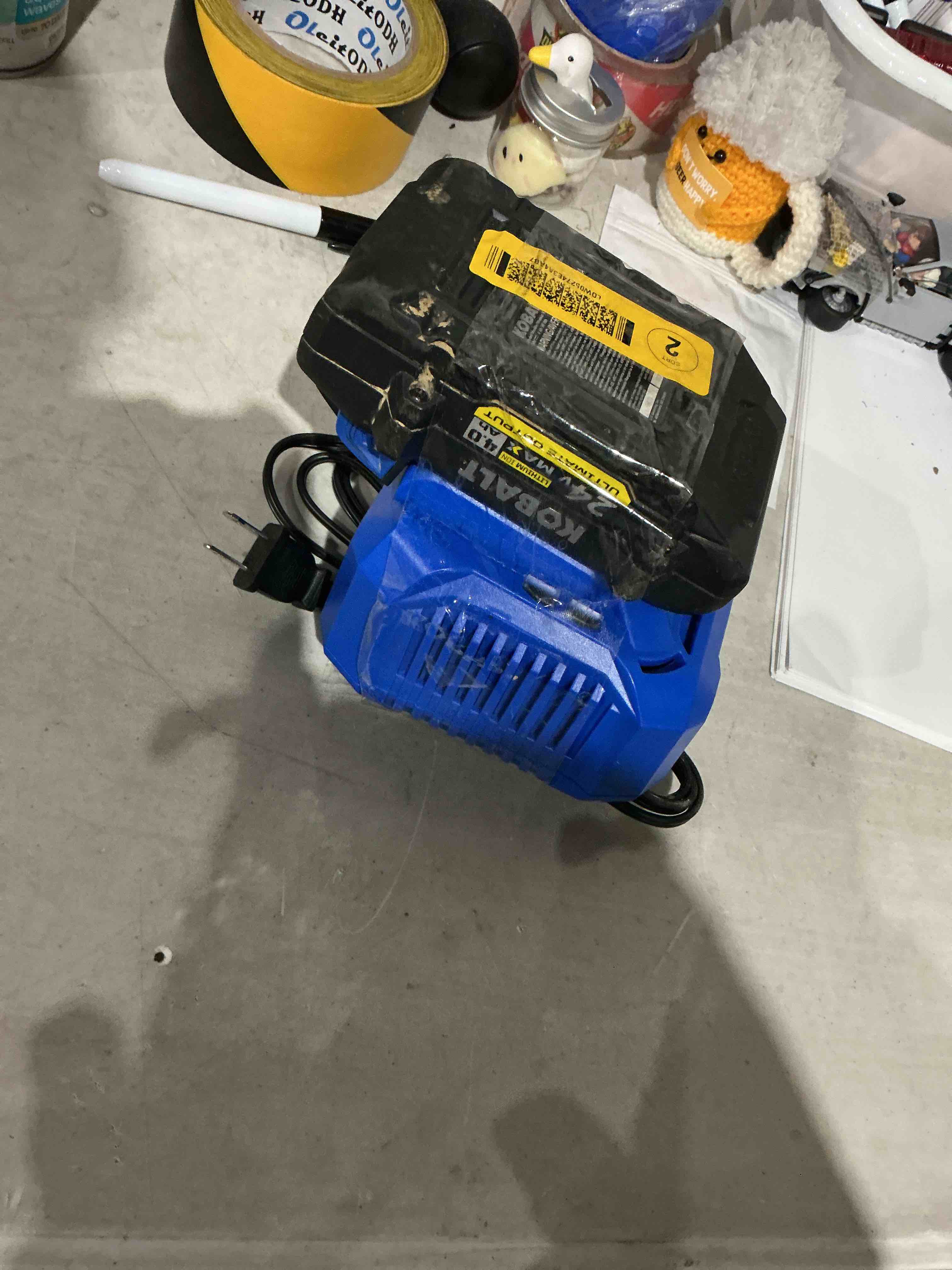 Condition photo showing As Is for kobalt ultimate output 24 -volt 1 -pack battery ( 4 ah lithium ) with charger
