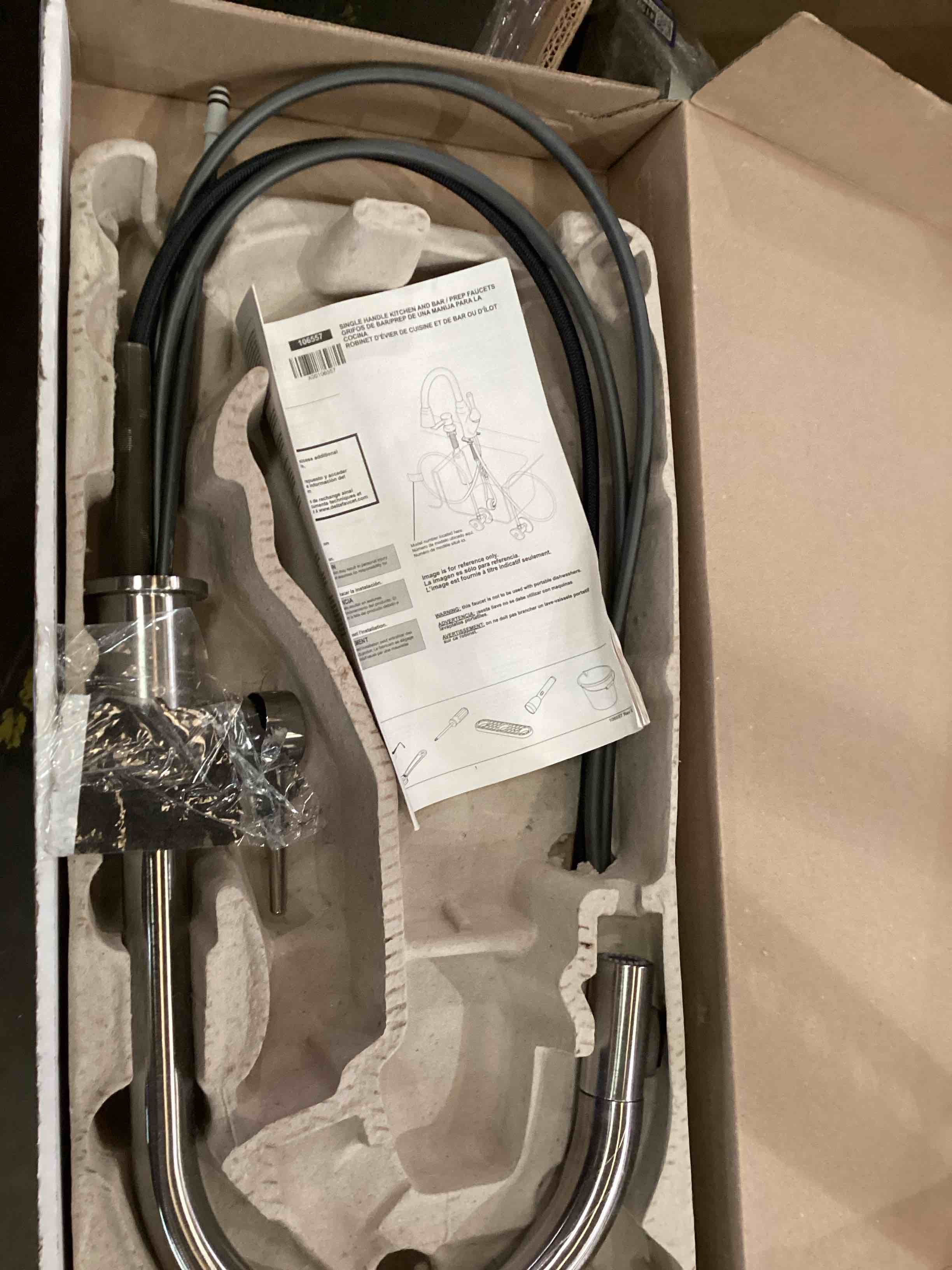 Condition photo showing As Is for Delta Faucet Trinsic Brushed Nickel Kitchen Faucet, Kitchen Faucets with Pull Down Sprayer, Kitchen Sink Faucet, Faucet for Kitchen Sink with Magnetic Docking Spray Head, Arctic Stainless 9159-AR-DST Arctic Stainless Standard Activation