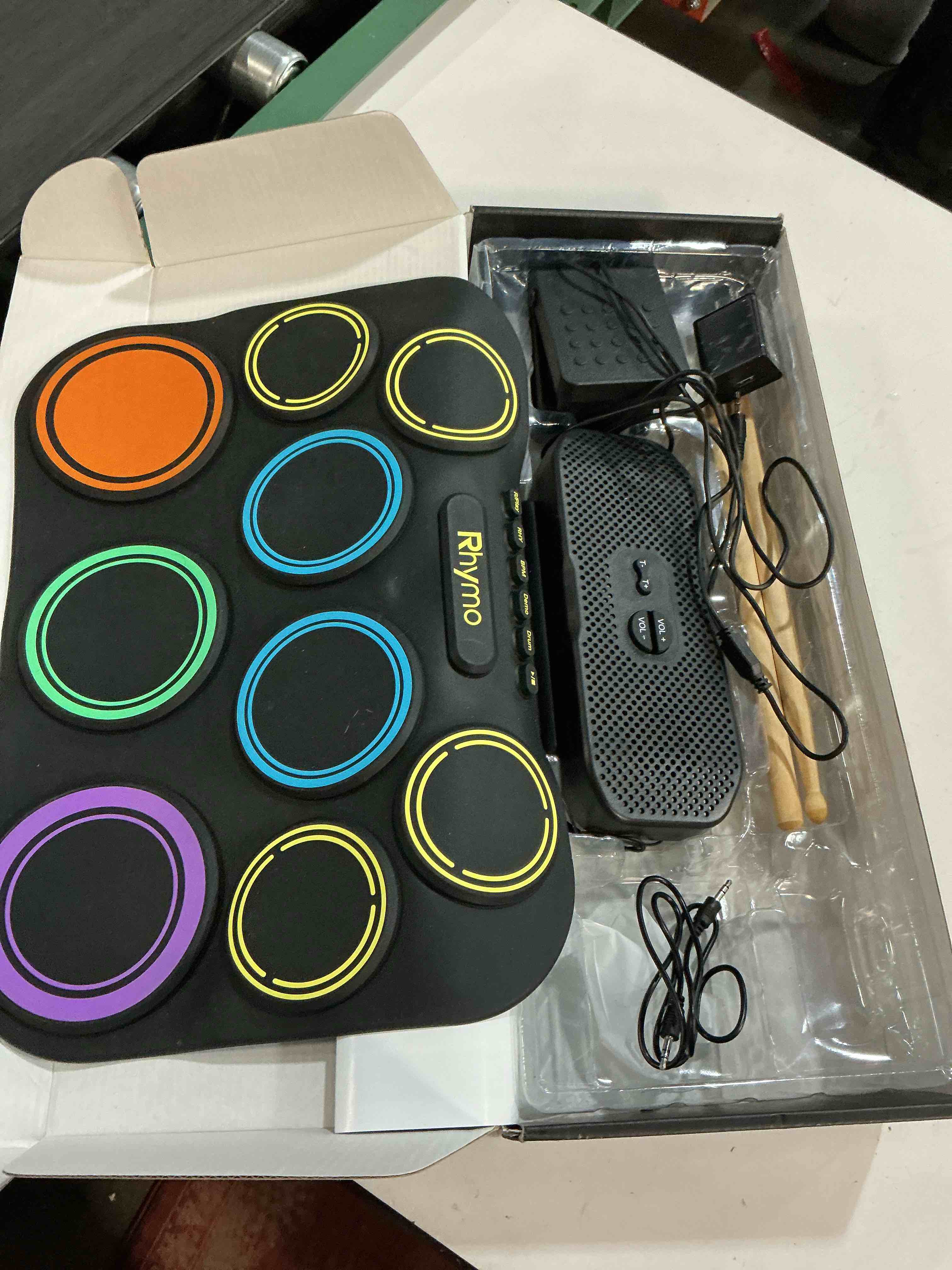 Condition photo showing Good Condition for rhymo electronic drum set, 9-pad roll-up with built-in speaker, rechargeable battery, headphones, drum pedal & sticks, perfect for beginners, home practice and travel gifts colorful