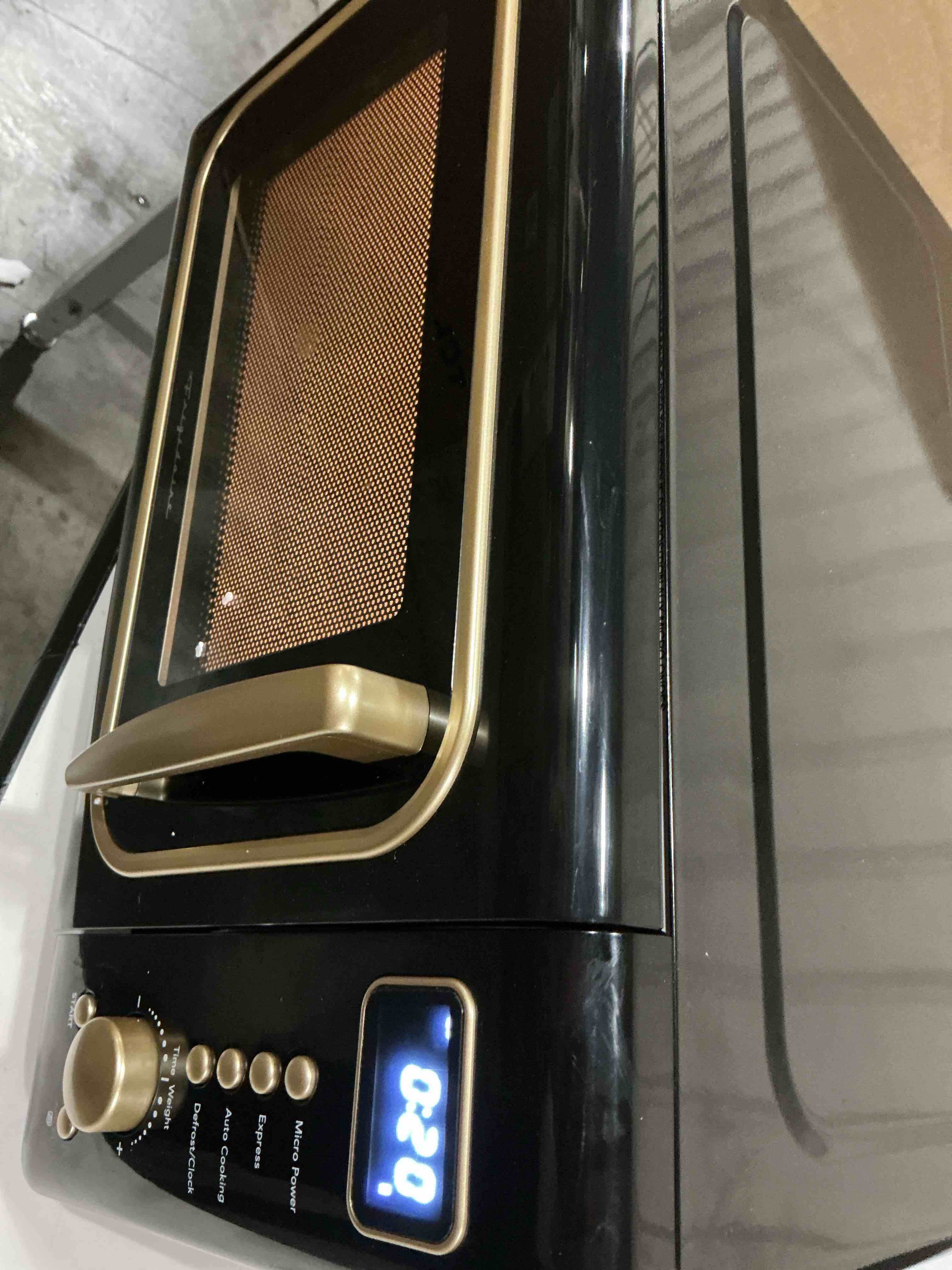 Condition photo showing As Is for FRIGIDAIRE EMW788RETRO 0.7 cu. ft. Retro Microwave, RoseGold Black Pink