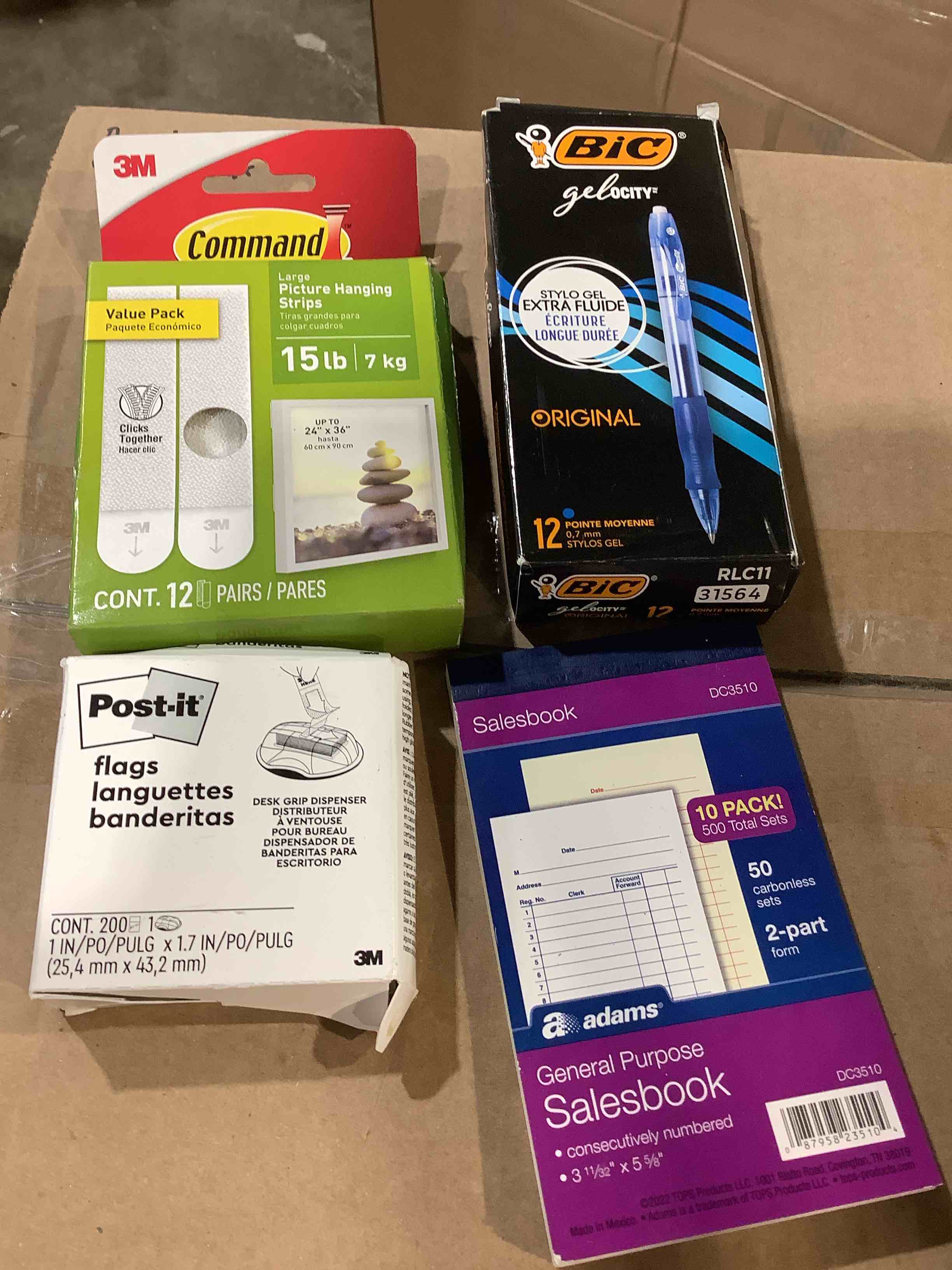Assorted office supplies: sales book, Postit flag, command strips, BIC GEL, PENS