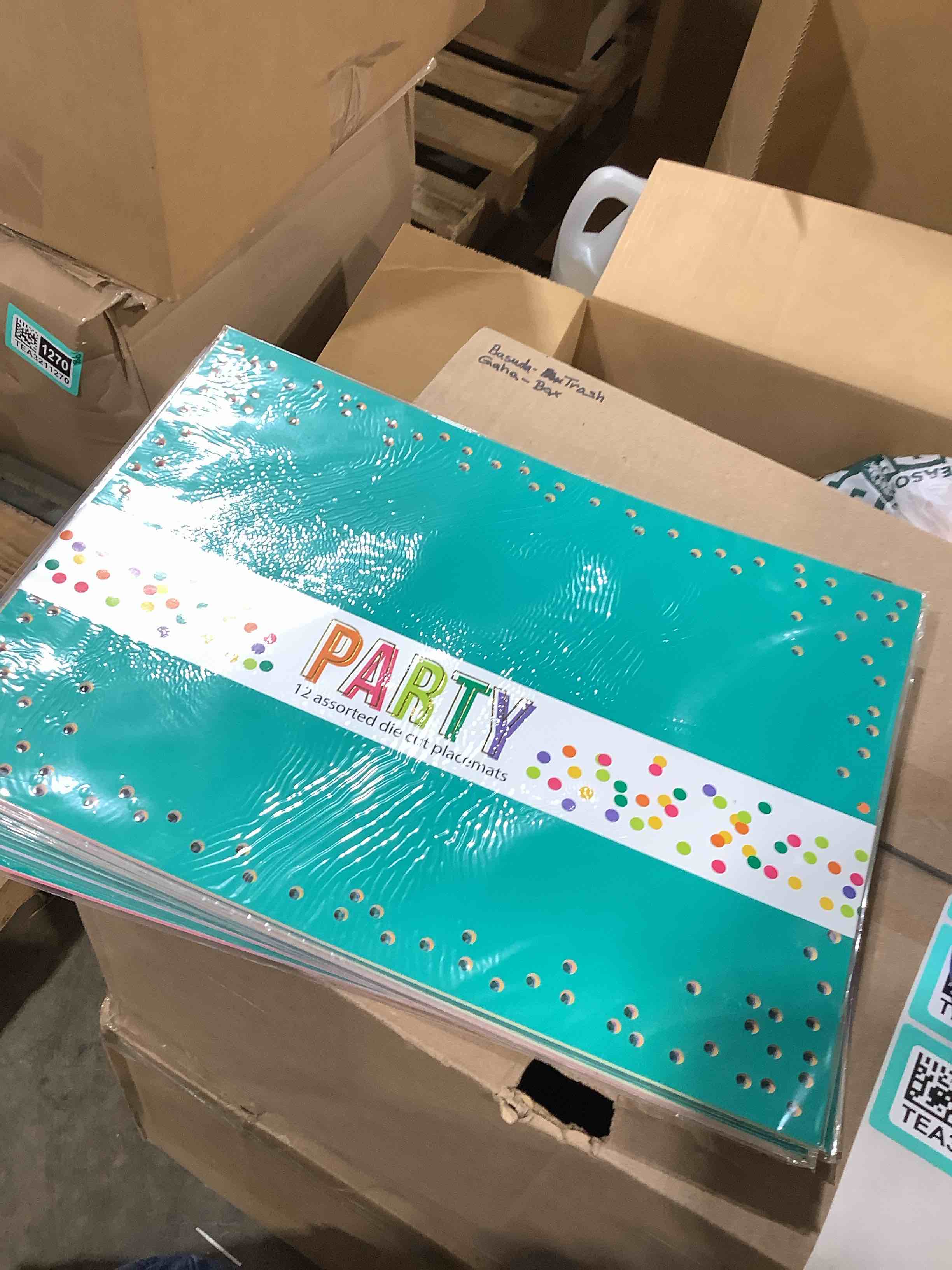 12 assorted die cut party placemats, eight count