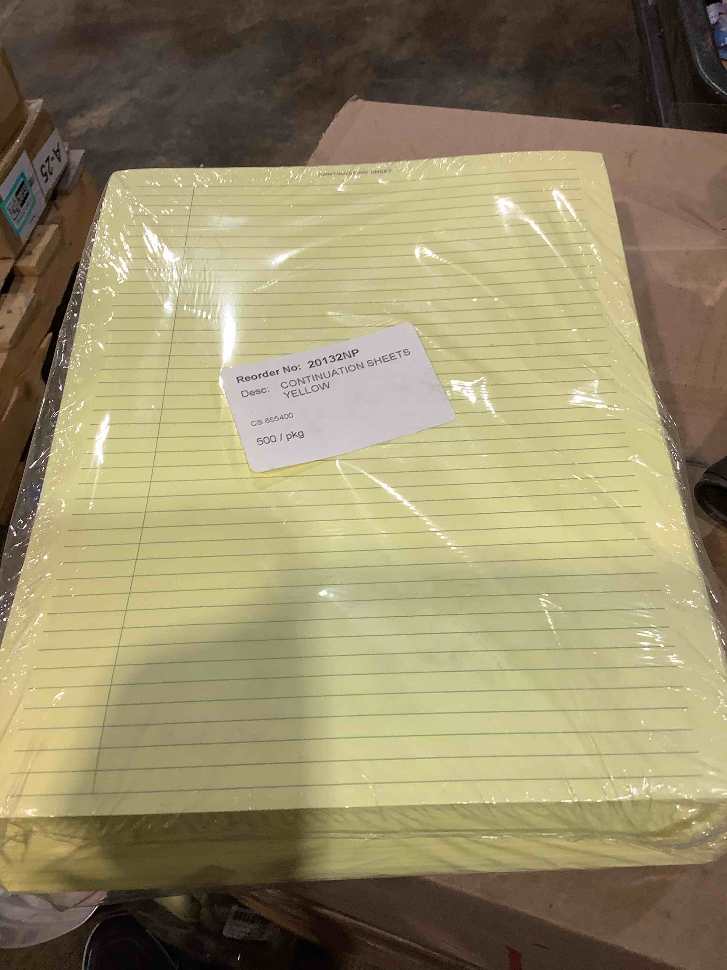 Condition photo showing New/Like New for continuation 8.5" x 11" line sheets yellow, 500 pack