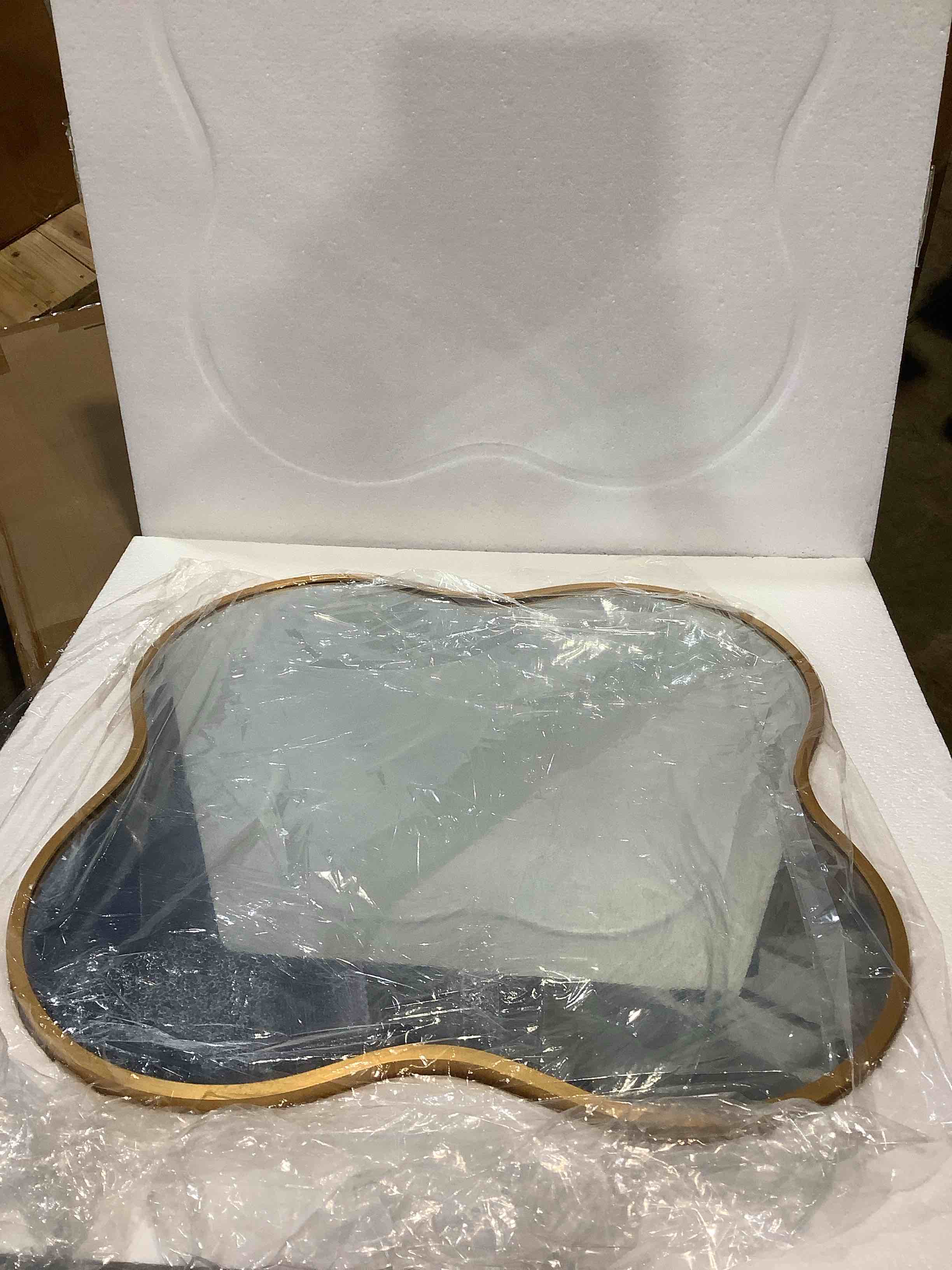 Aluminum, gold rim, wavy mirror