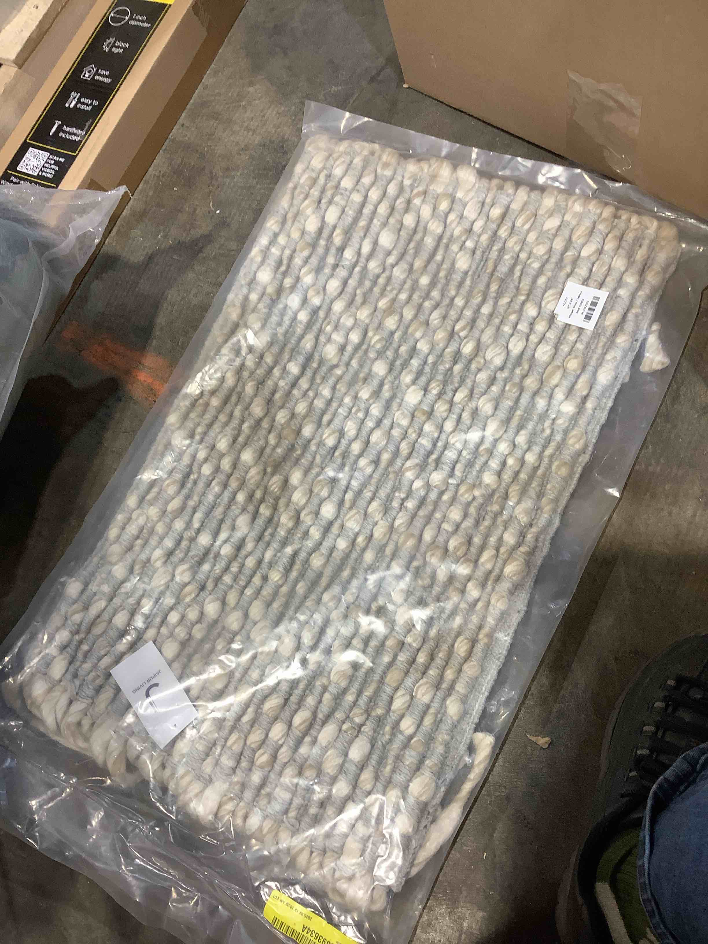 Condition photo showing New/Like New for upson whisper white 16" x 24" fringe rug
