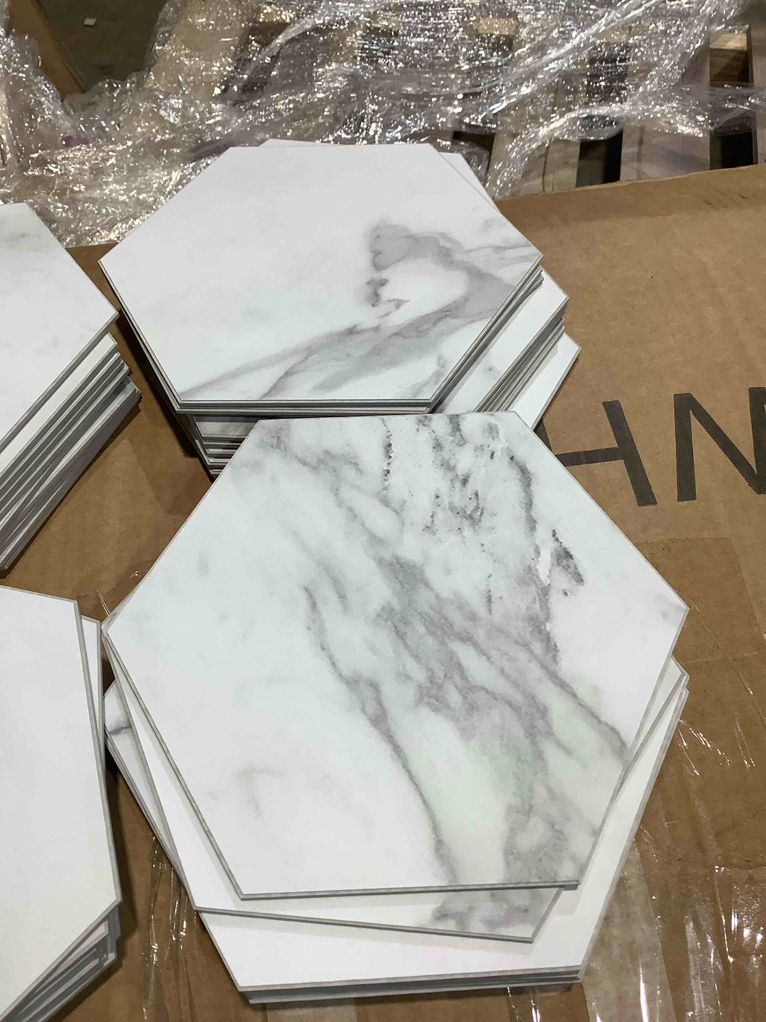 Condition photo showing New/Like New for peel and stick smoky white hexagon tiles, approximately 50