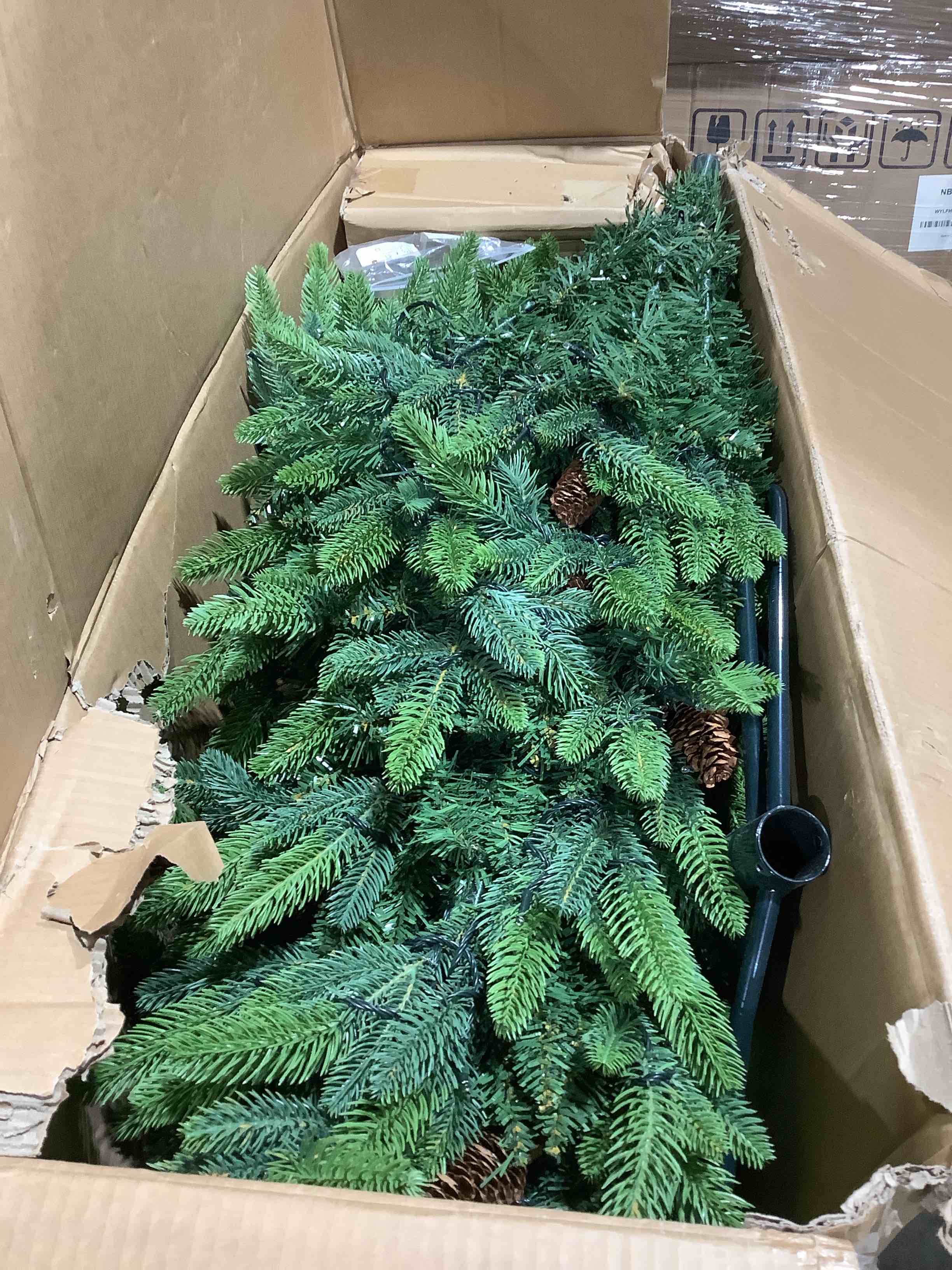 Condition photo showing As Is for 6 foot pre-lit artificial Christmas tree with pinecones