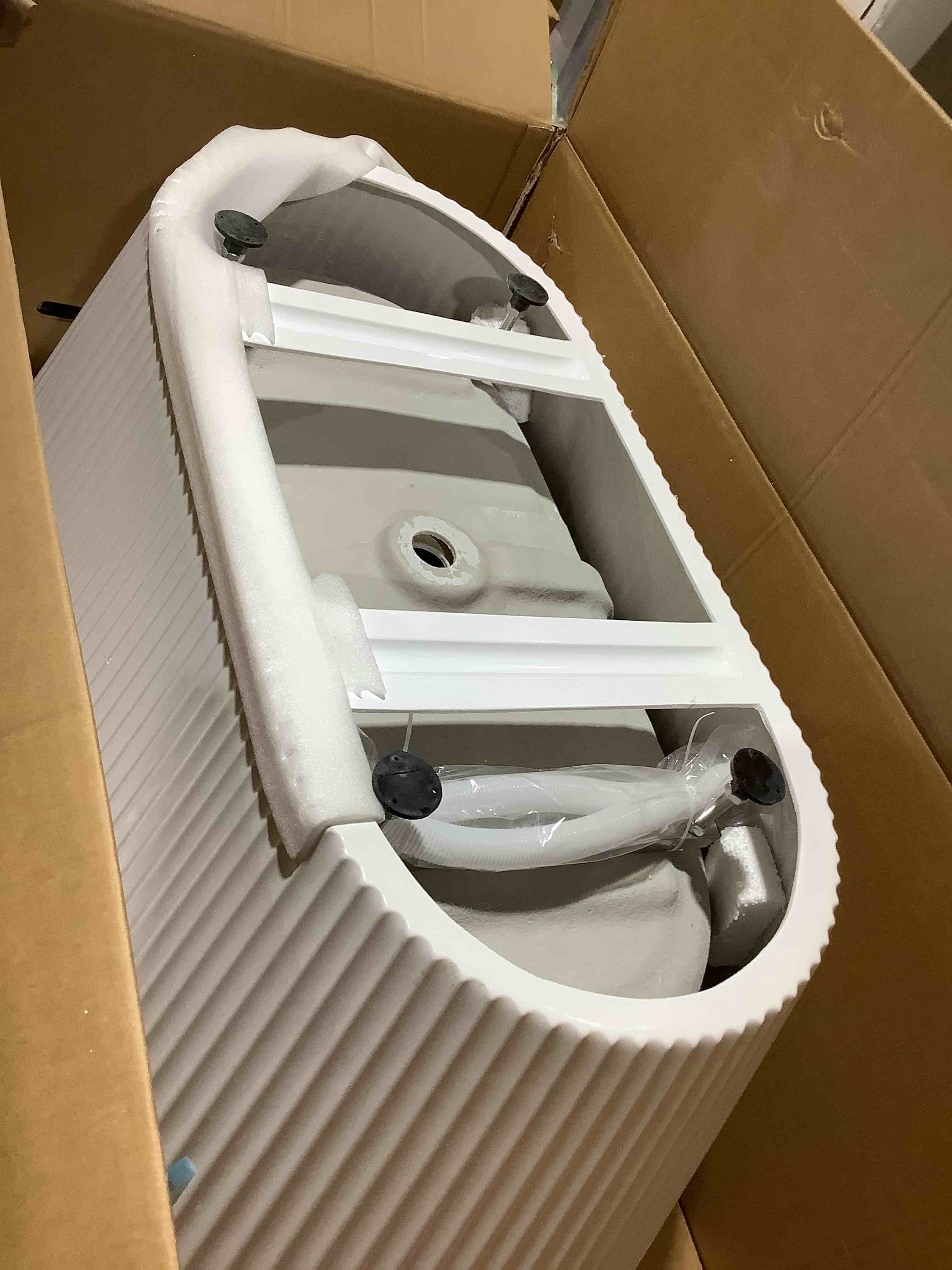 Condition photo showing New/Like New for 59 inch free standing bathtub in glossy white Acrylic with fluted ripple trim, deep soaking tub 