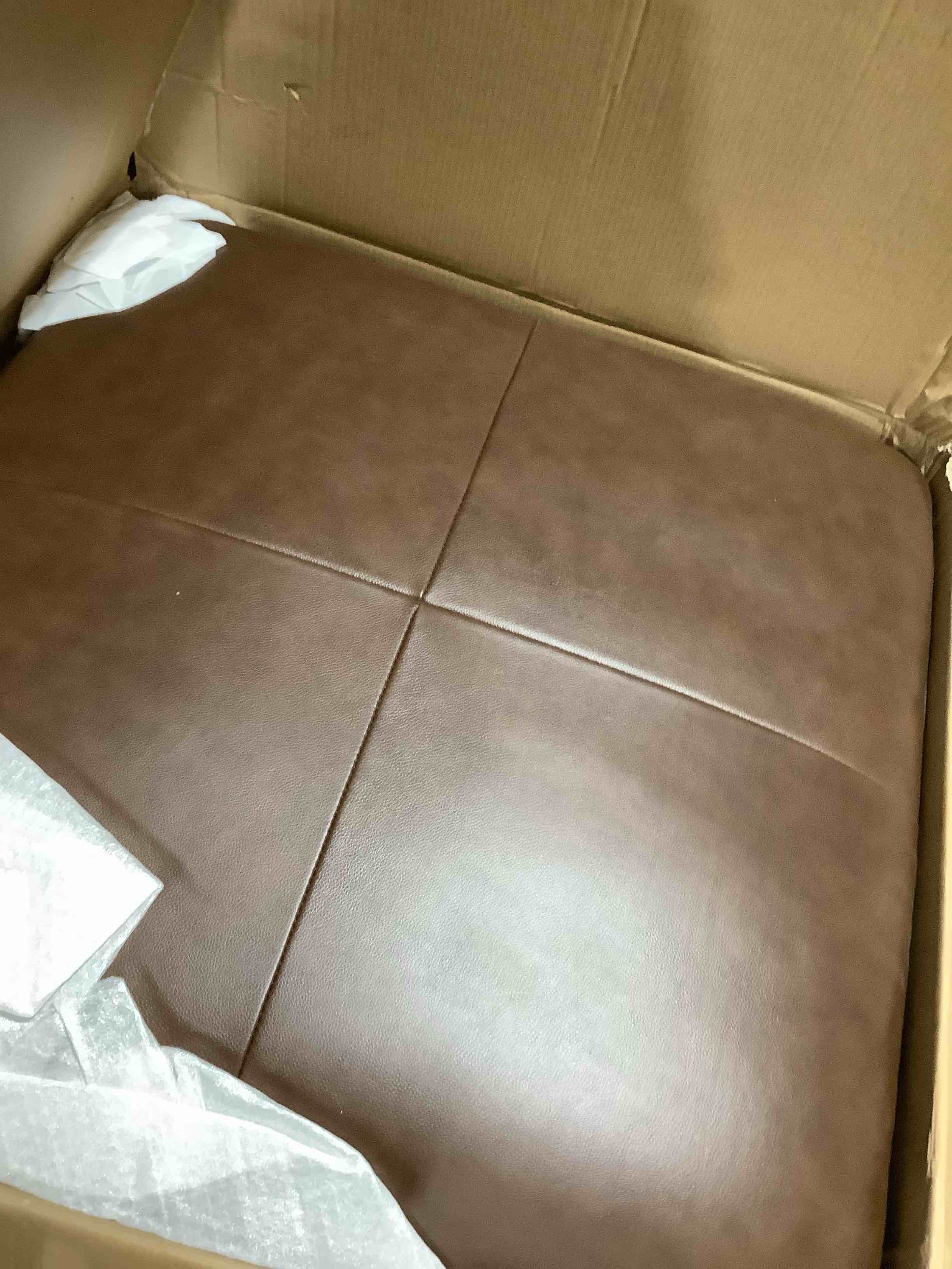 Condition photo showing New/Like New for d79503-o faux leather brown ottoman