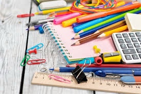 Mixture of office and school supplies ,paper, pencils ,notebooks, etc