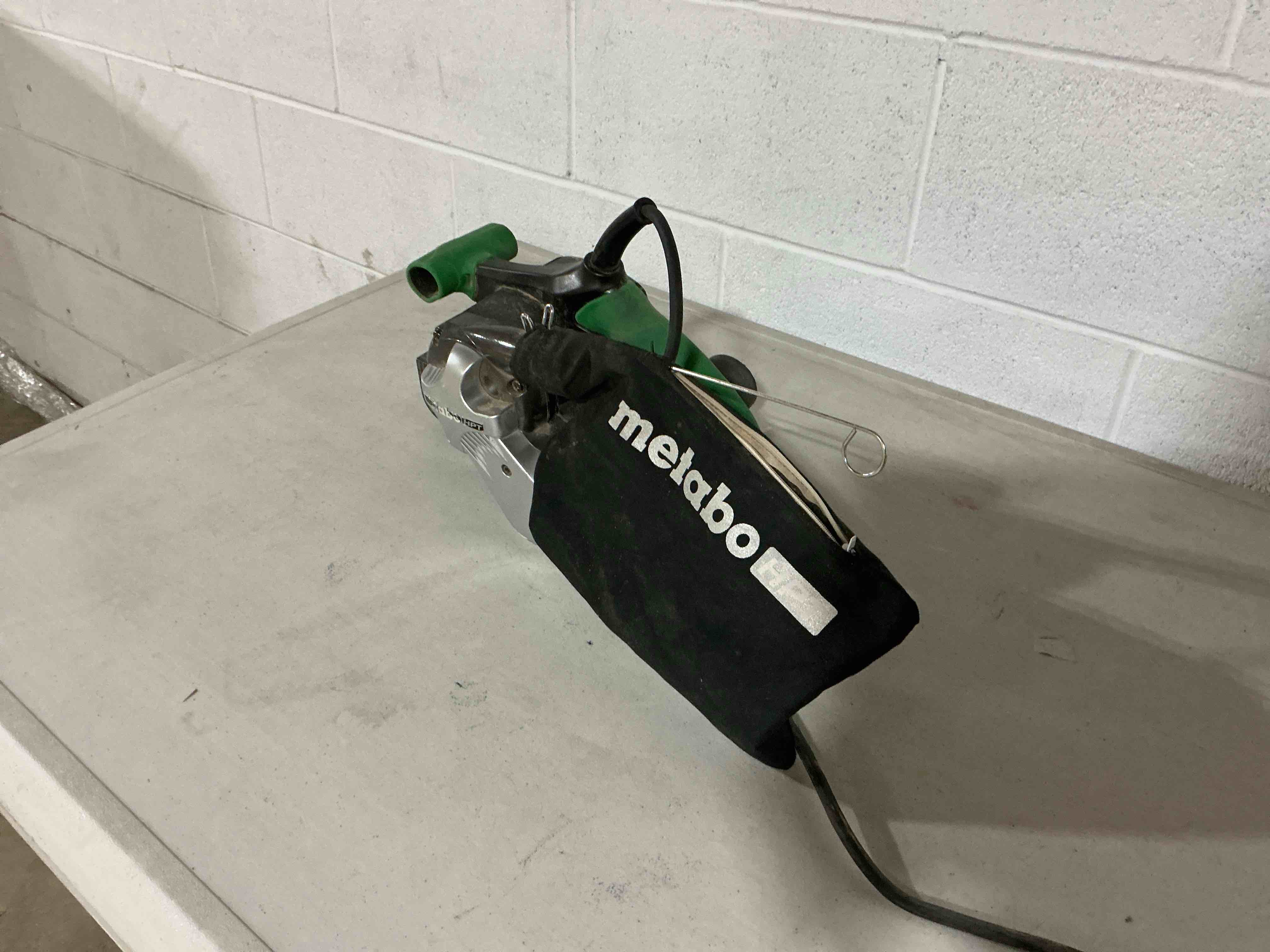 Condition photo showing As Is for metabo hpt belt sander | 3 x 21 inch | for woodworking | variable speed | 9.0 amp motor | soft grip | 5-year warranty | sb8v2