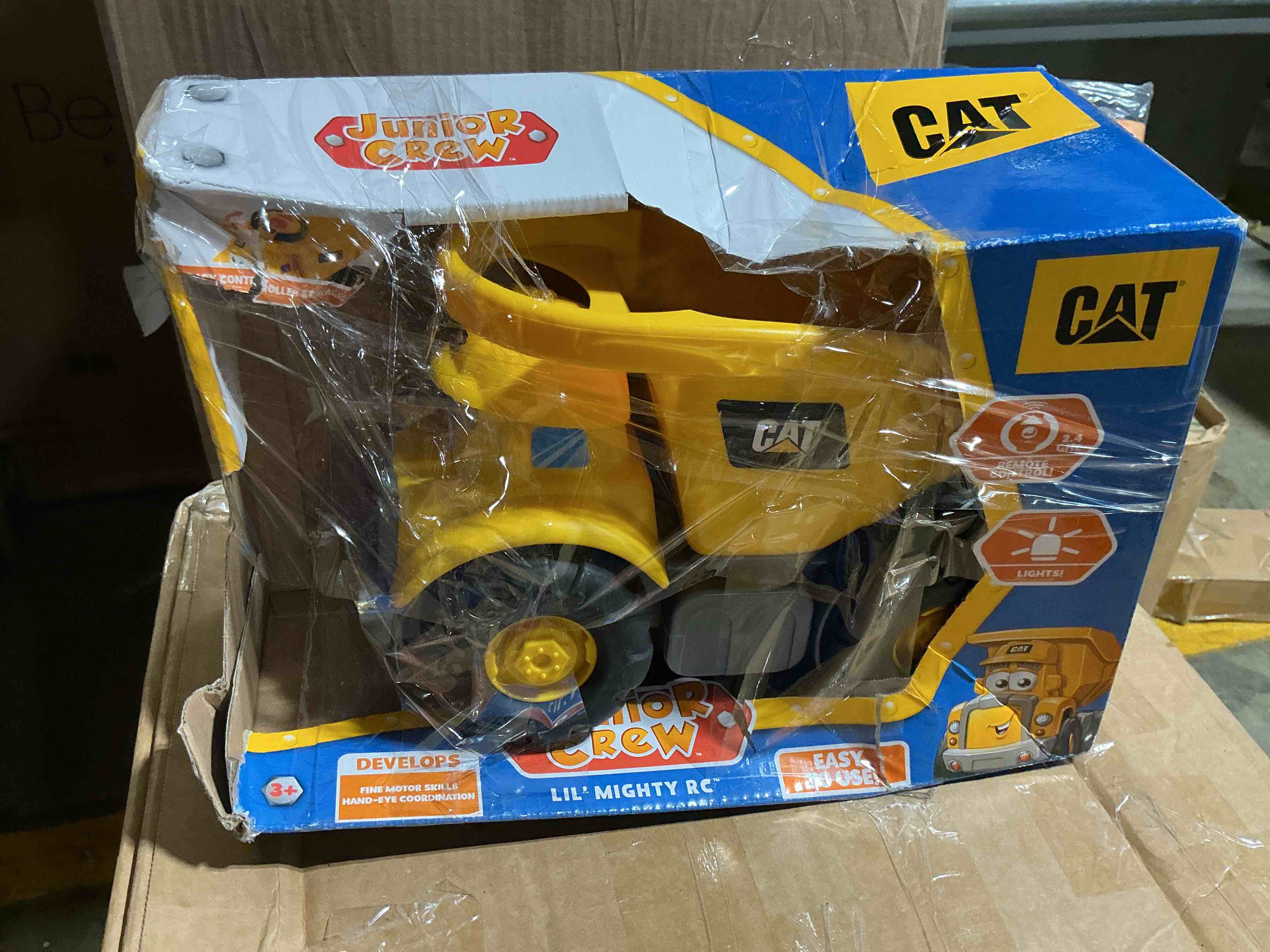 Condition photo showing Good Condition for cat construction toys, junior crew lil' movers remote control truck, rc car + dump truck, working headlights, with child friendly controller