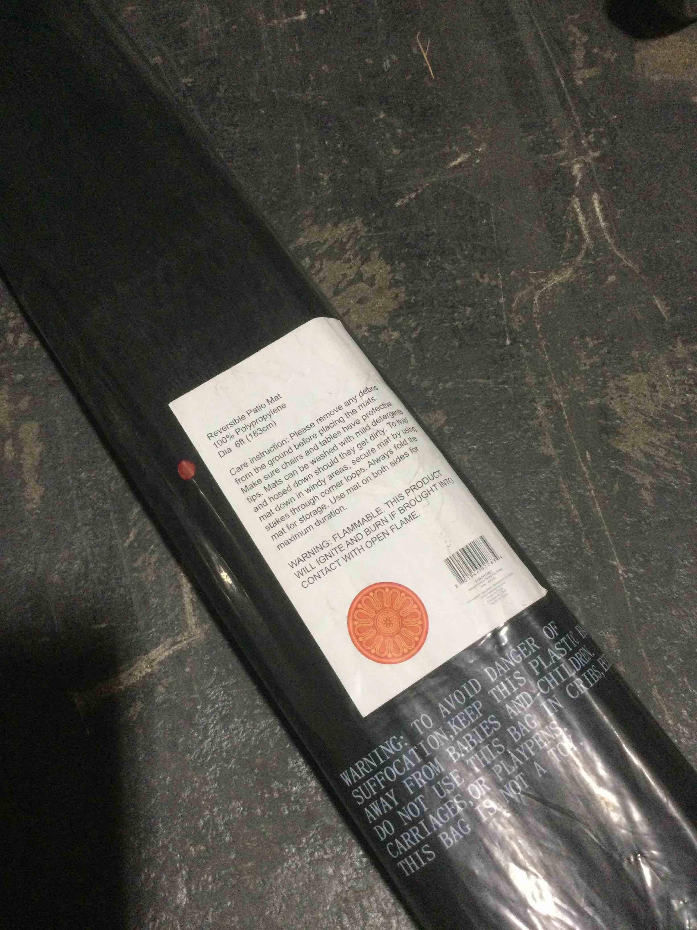 Condition photo showing New/Like New for Barbara king 6’ indoor/outdoor round patio mat, sunset