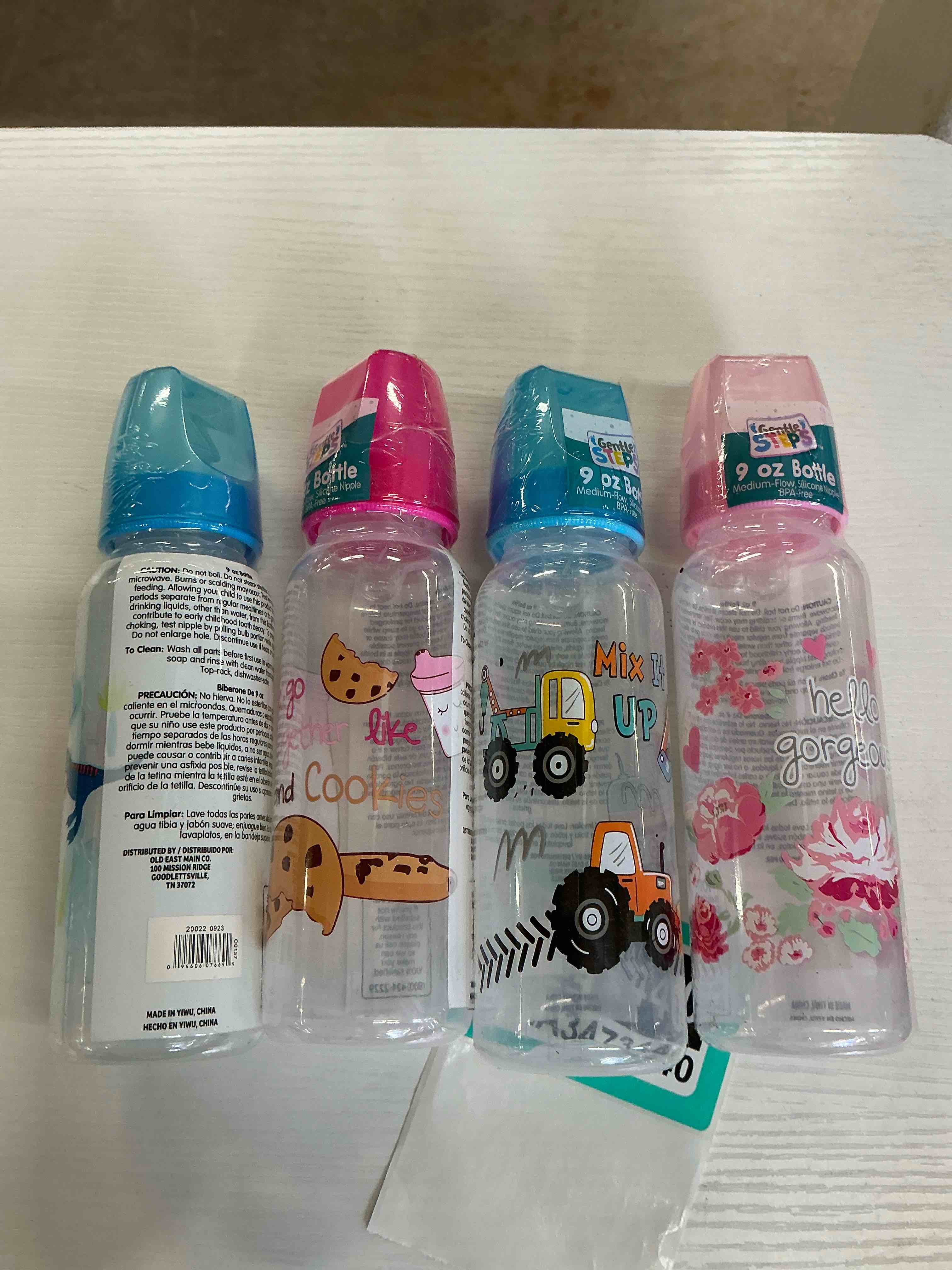 Four pieces of baby bottles (pink and blue)