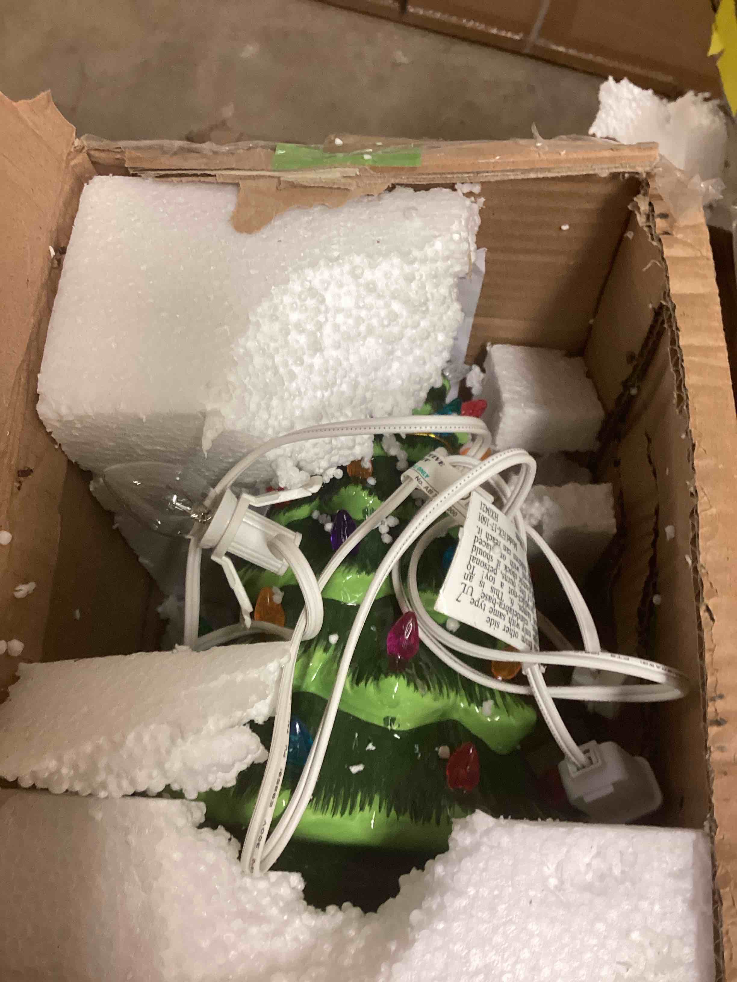 Condition photo showing As Is for Lighted vintage Christmas tabletop tree