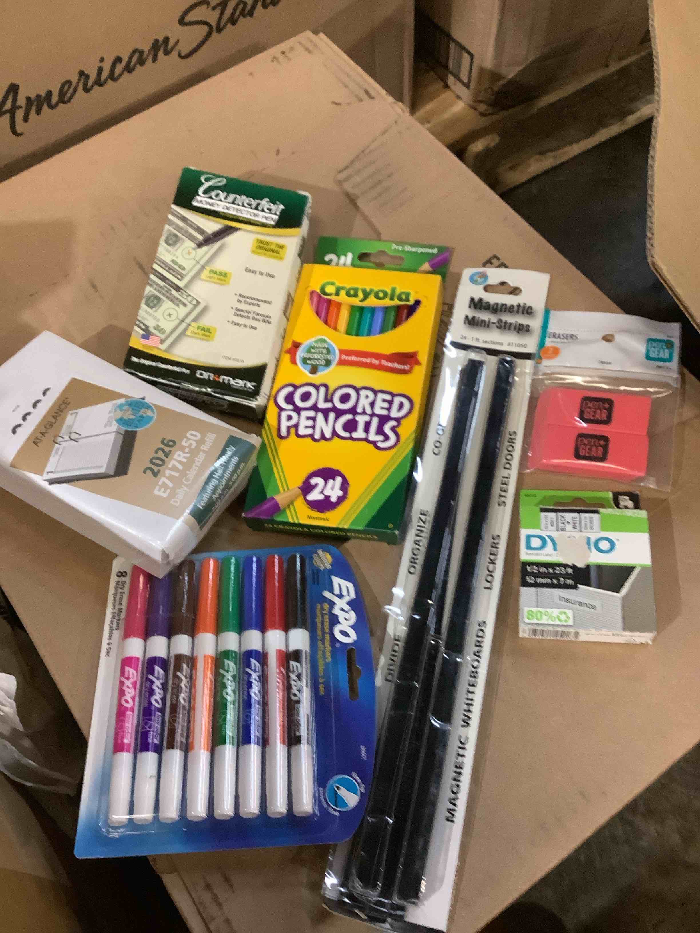assorted office supplies; crayon colored pencils, counterfeit, money detector, 2006 calendar, refill, expo, dry erasers, magnetic, mini strips, erasers, Dino labels and more