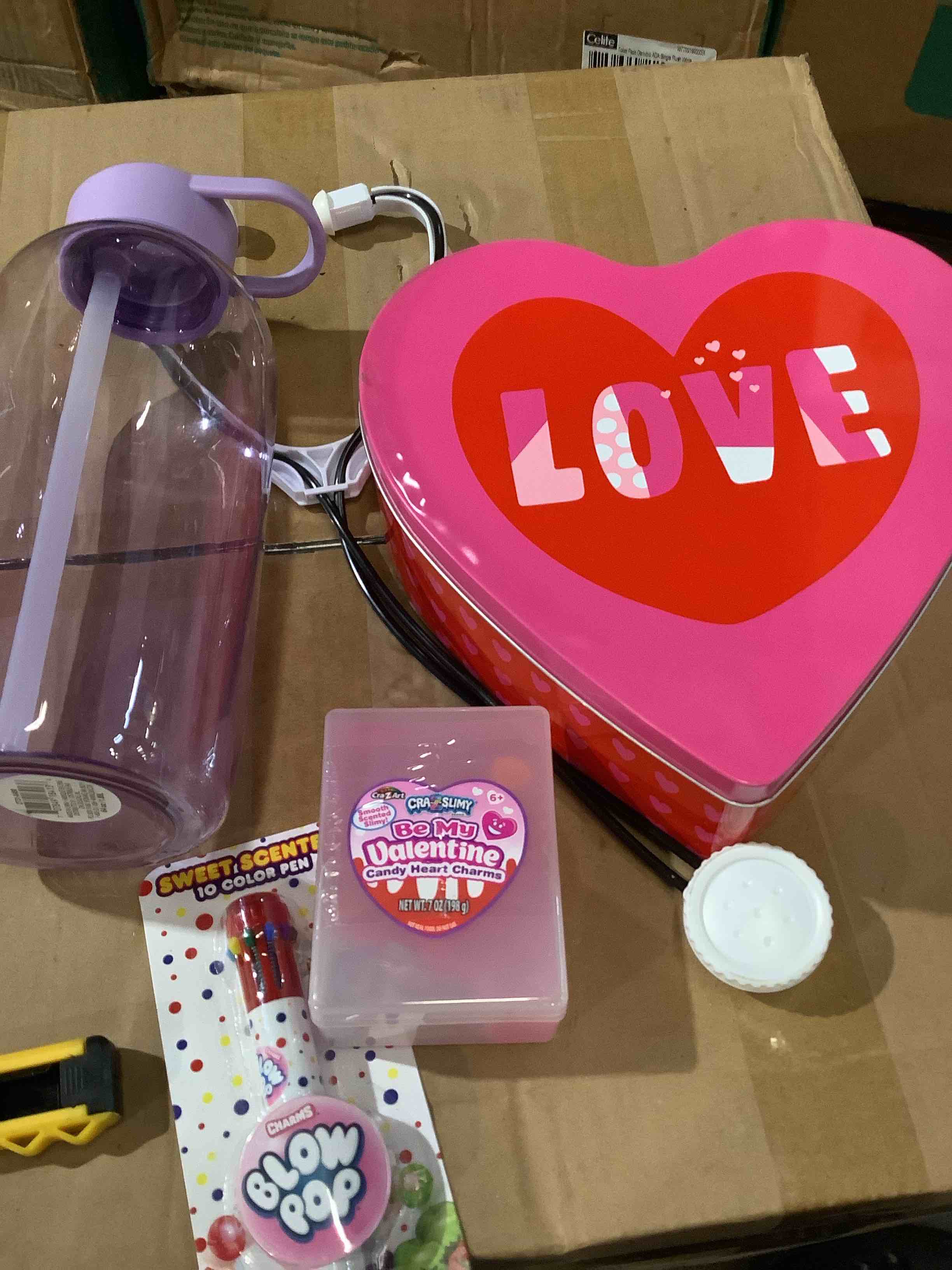 Assorted toys and decoration; 64oz water container, heart-shaped tin, crazy slime, stethoscope, scented sweet color pen