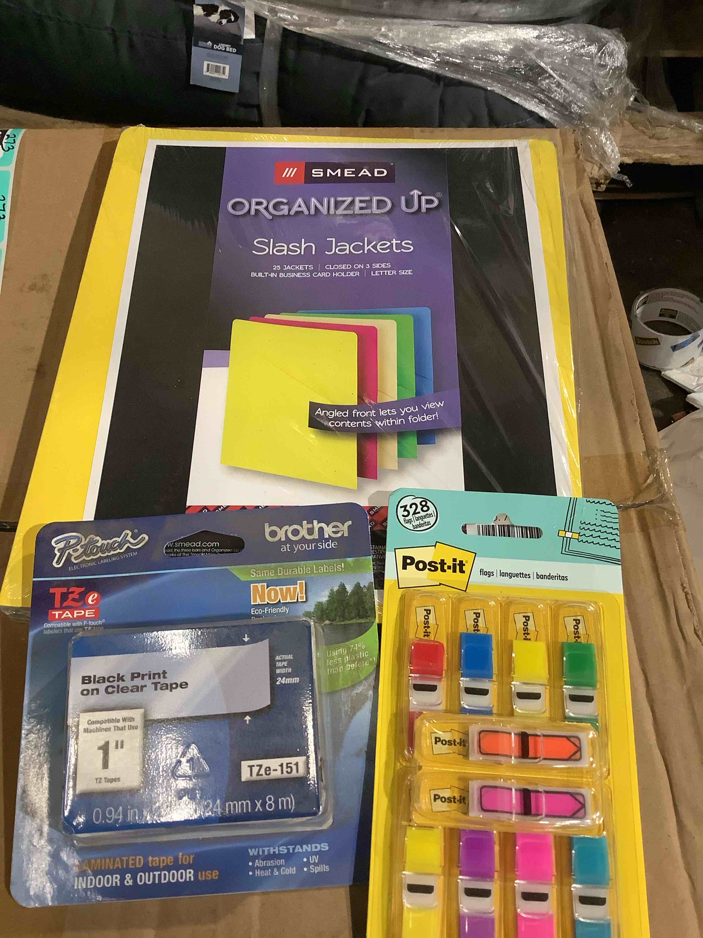 assortment of office supplies: organized up/jackets, Post-it, notes stickers, brother black print on clear tape 1 inch