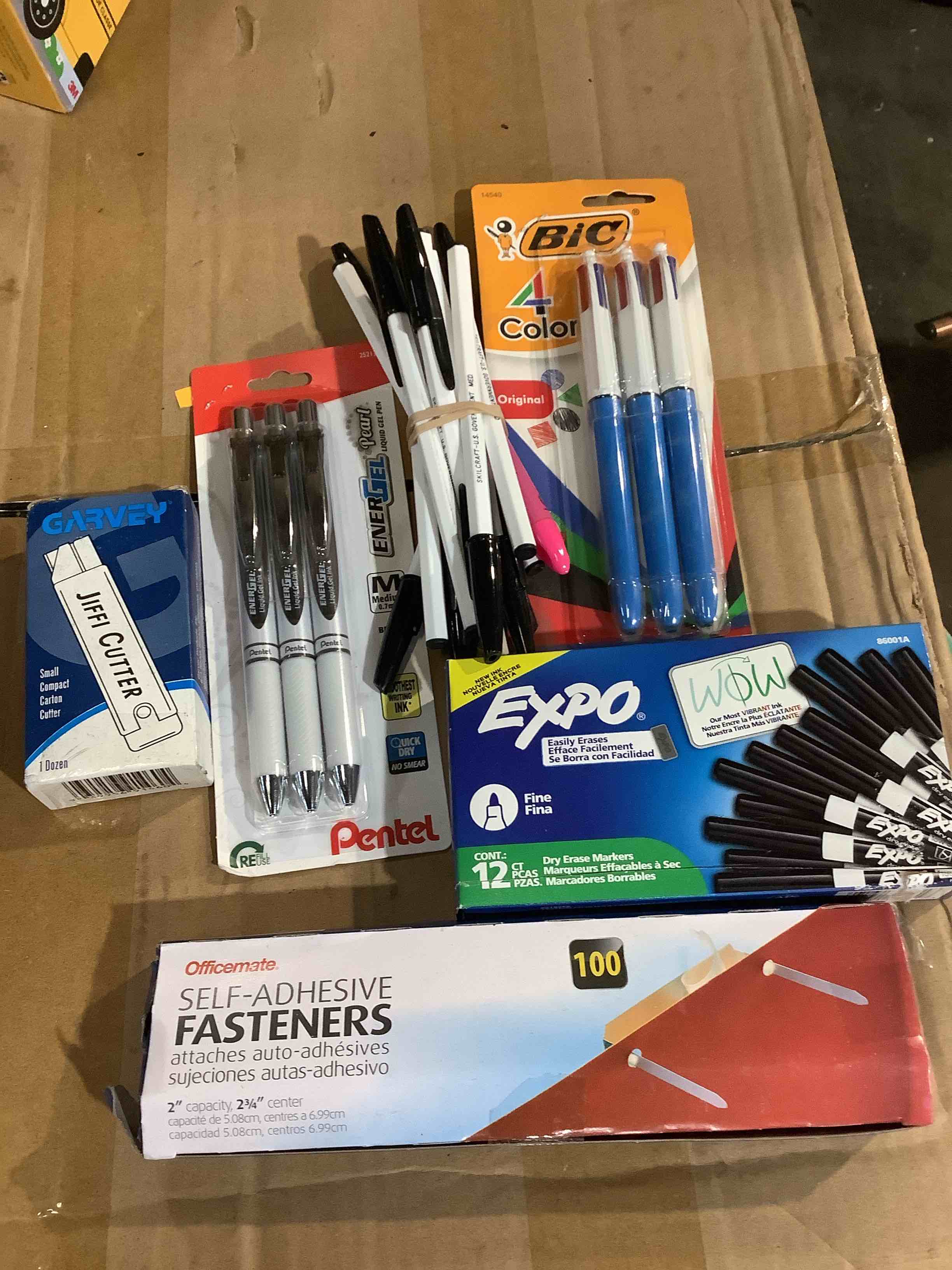 assorted office supplies: expo, dry, eraser, markers, black, office made self adhesive fasteners, Jiffy, cutters, penile pins, and much more
