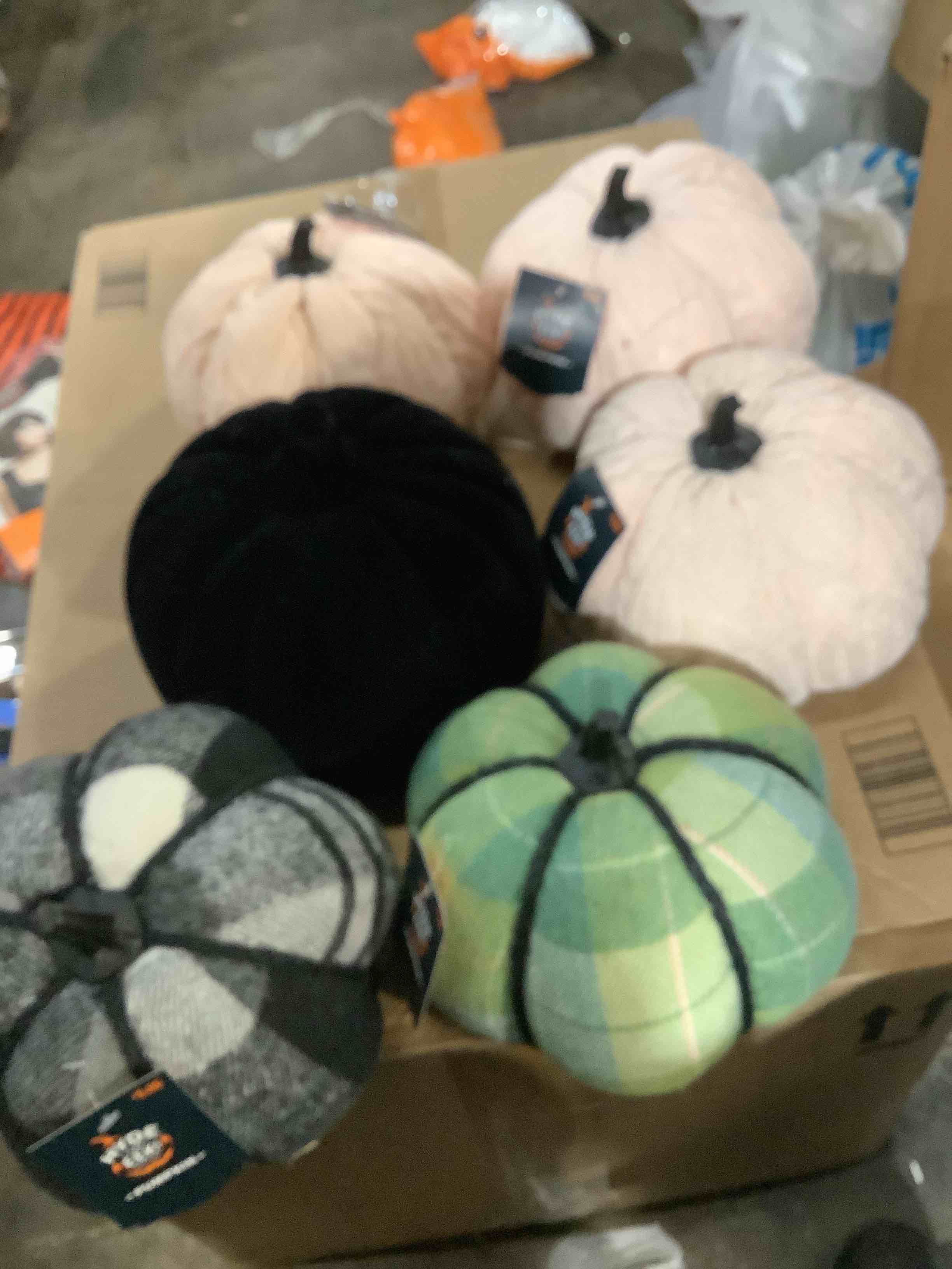 an assortment of Halloween cloth and knitted pumpkins