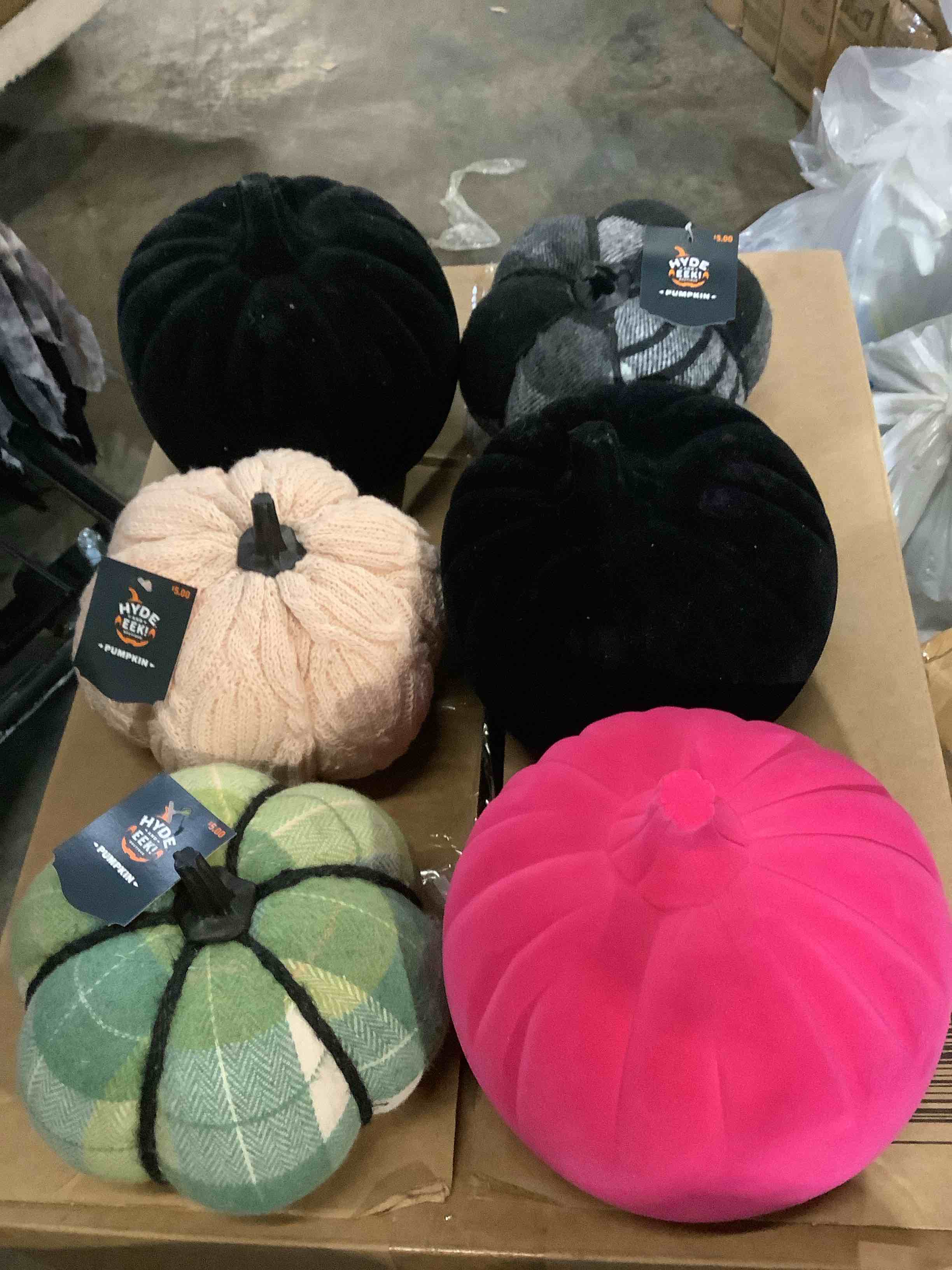 assortment of Halloween pumpkins, knitted cloth, and velvet