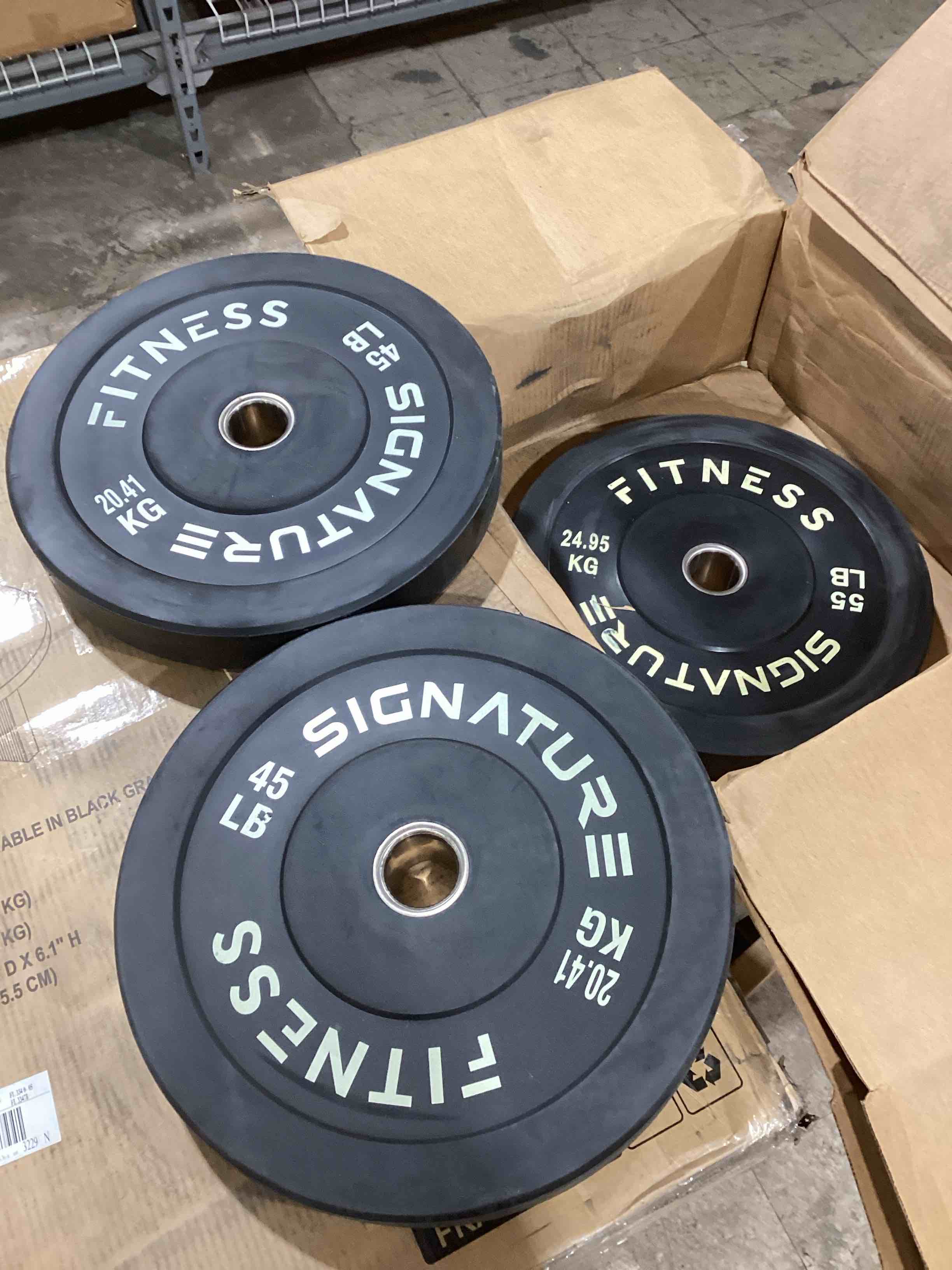 Signature Fitness. set of 2- 45lb weights and 55 lb weight