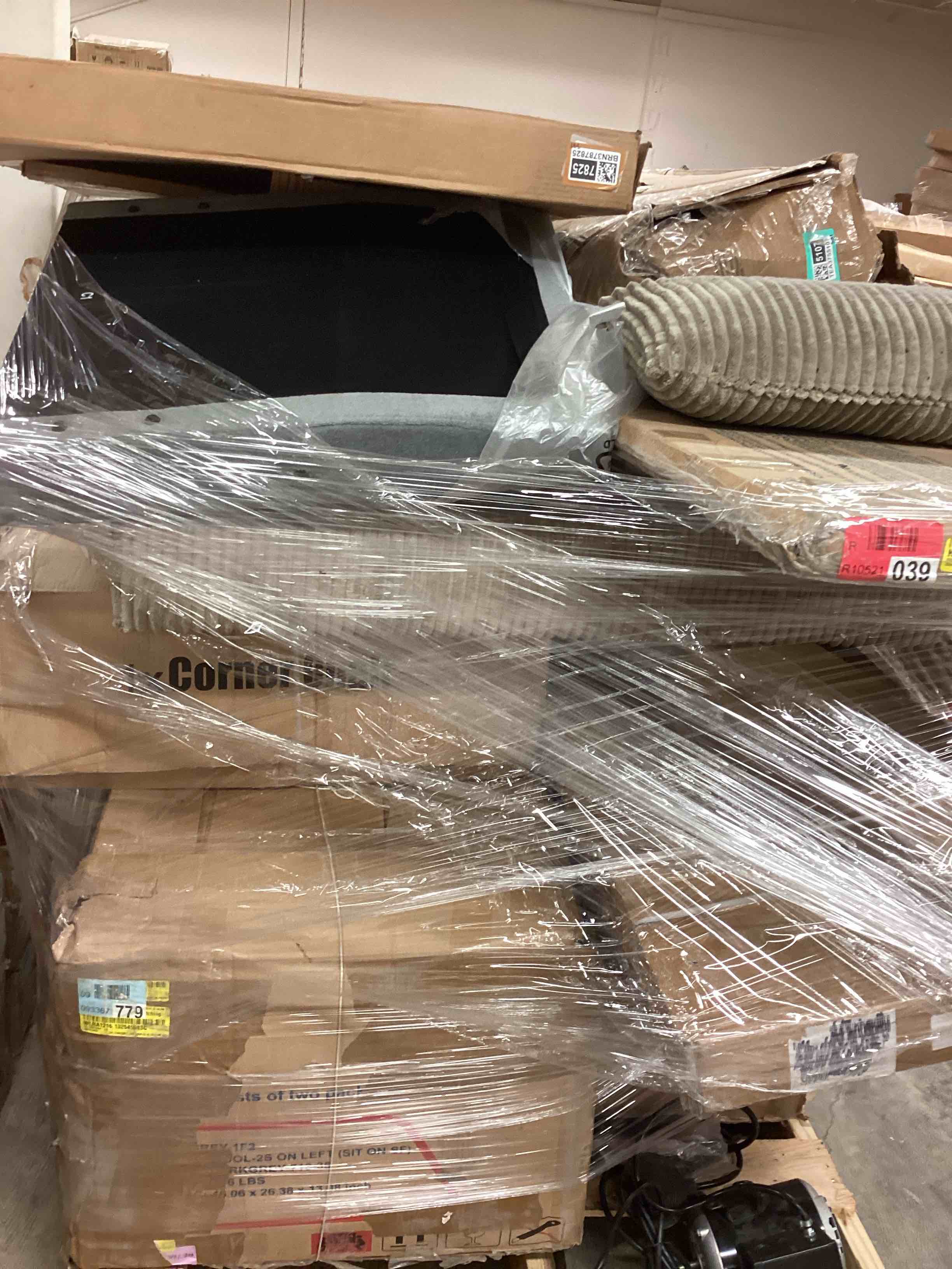 pallet lot of items for home furnishings includes parts of sofa/ parts upholstered corner sectional /sliding door track / toddler bed rail/ bifold door primed and more)