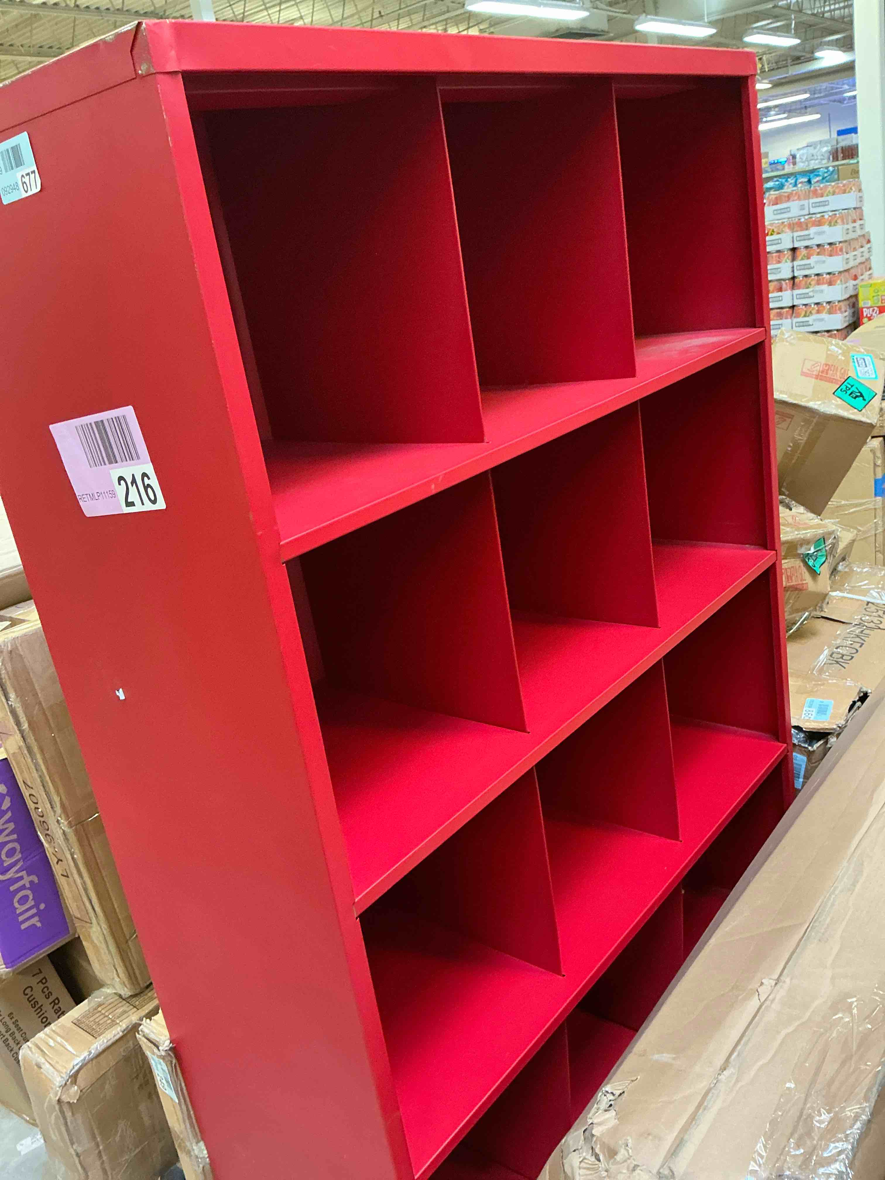 Condition photo showing As Is for 66 in. h x 46 in. w x 18 in. d red steel 12-cube storage organizer