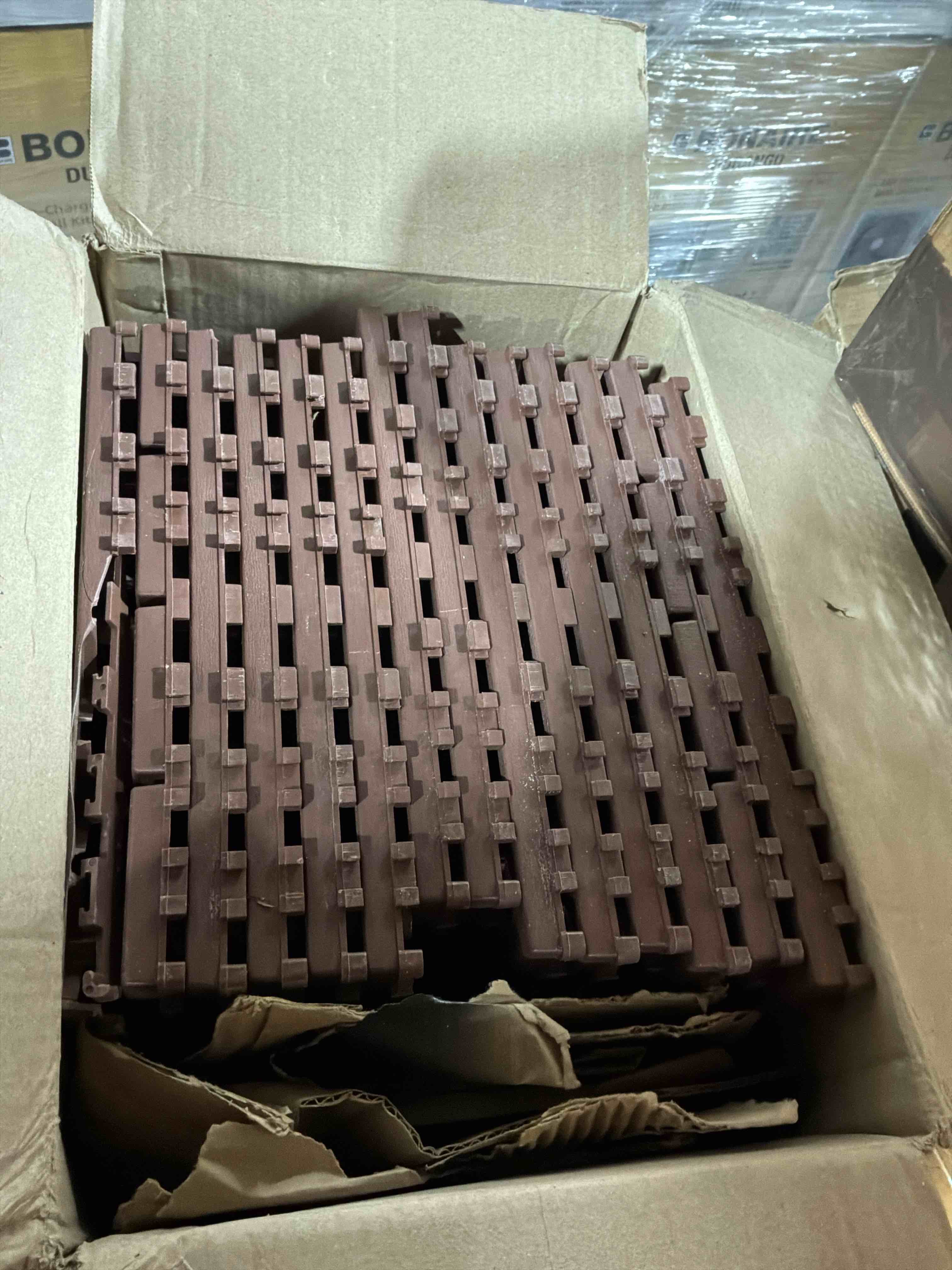 Condition photo showing New/Like New for 12 in. x 12 in. outdoor square plastic interlocking flooring deck tiles for courtyard garden (44 pieces) in brown