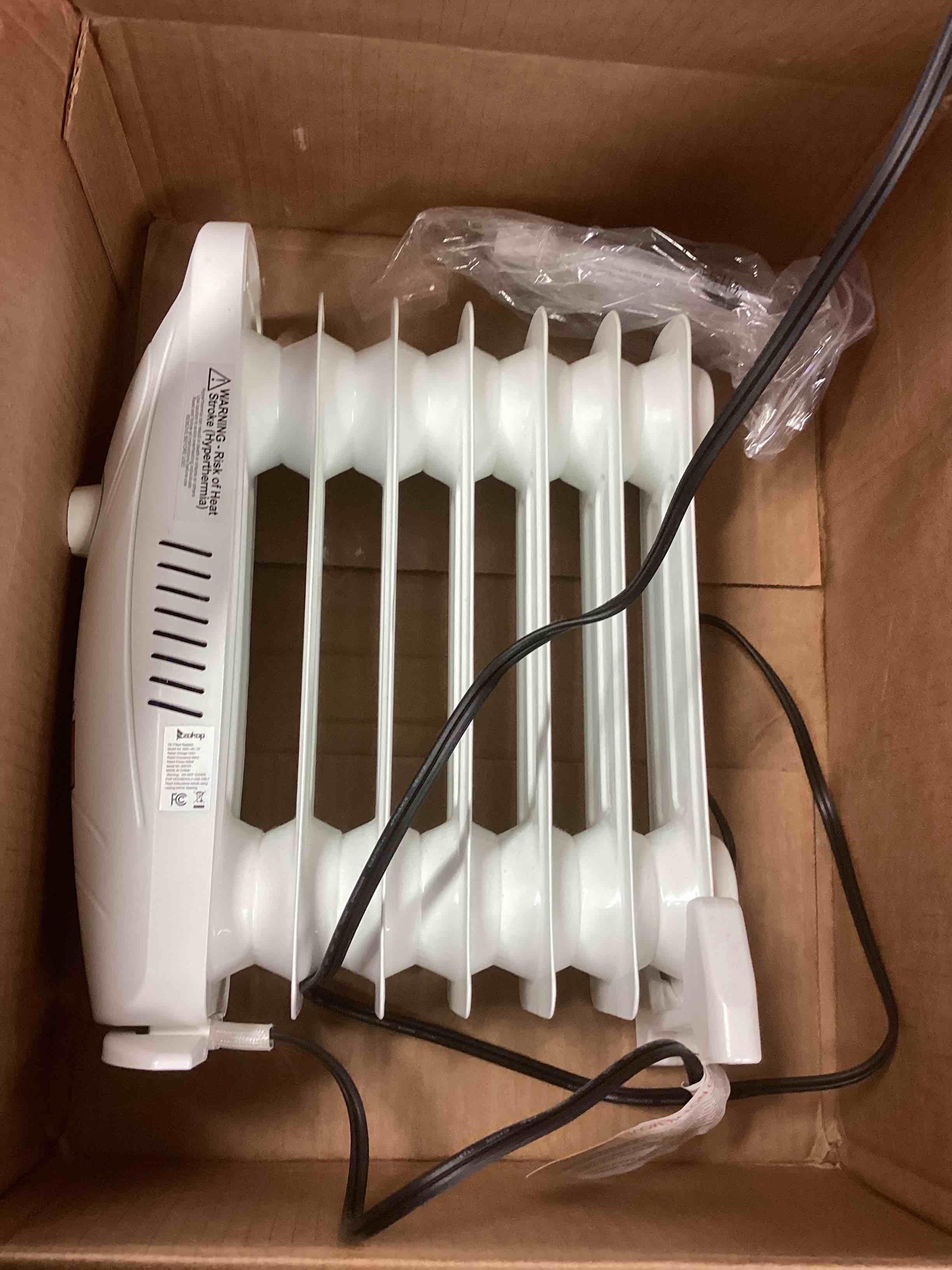 Condition photo showing As Is for zokop oil filled radiator 