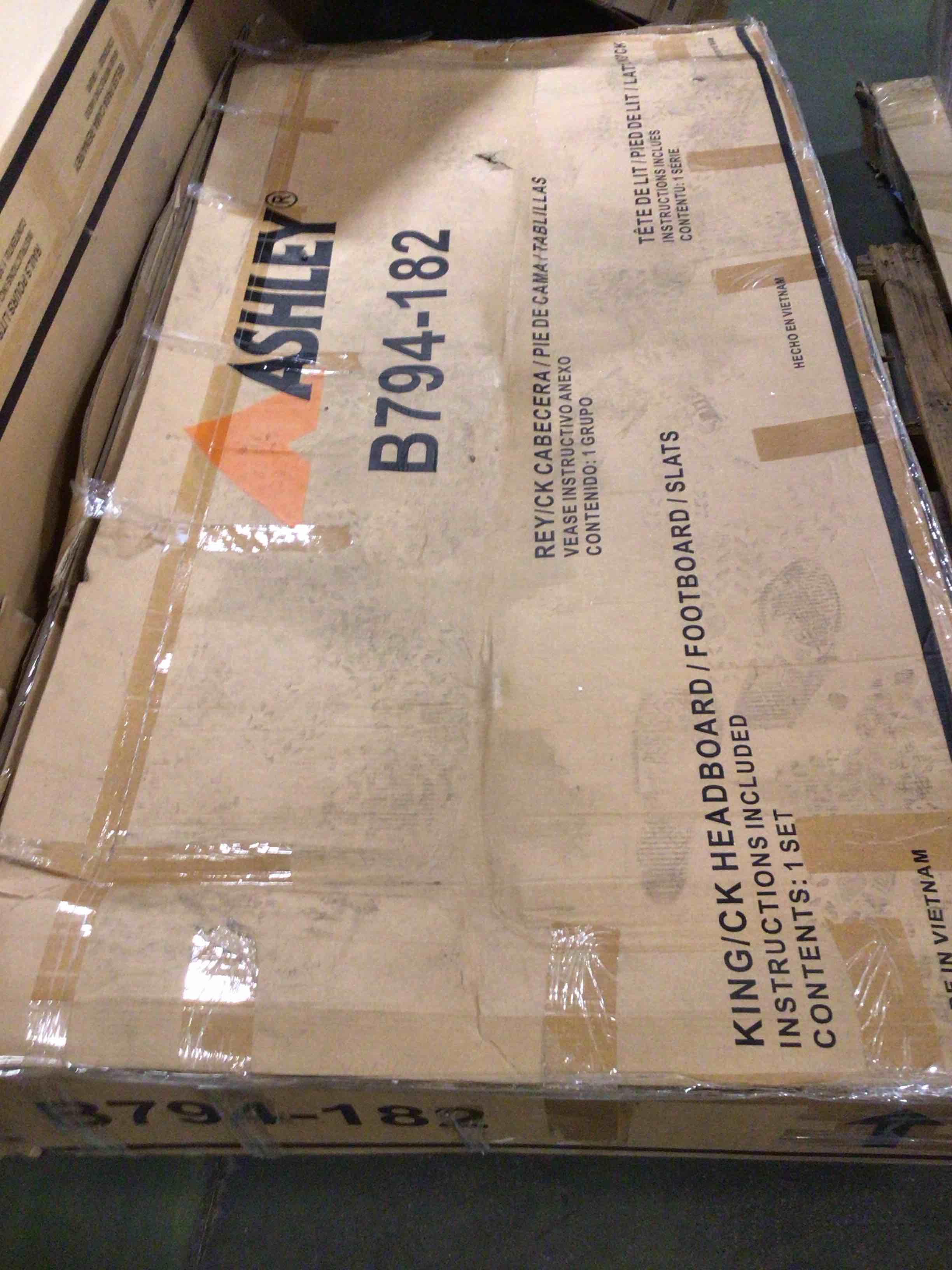 Condition photo showing As Is for kristiland king upholstered storage bed