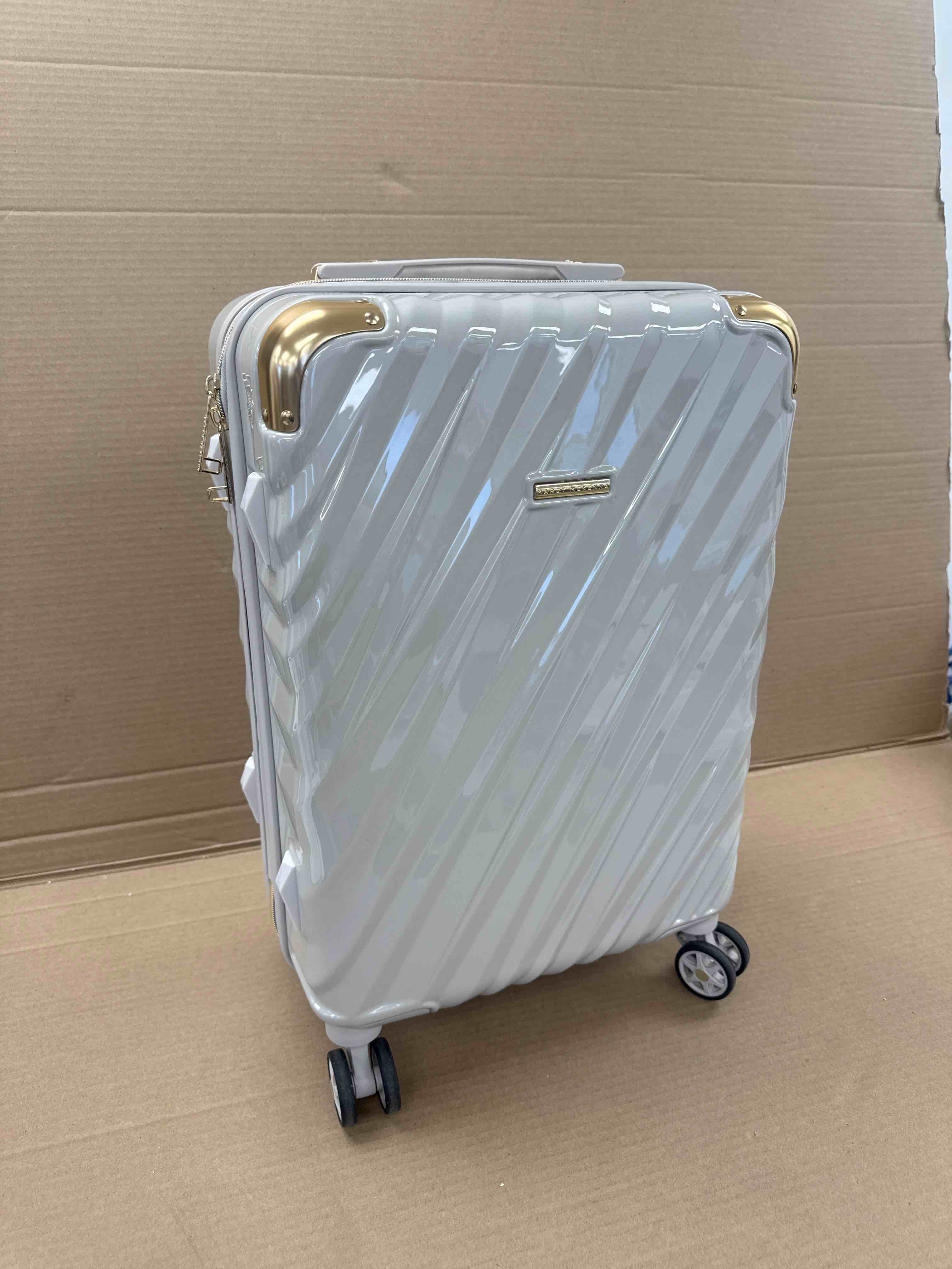 Condition photo showing New/Like New for marcy mckenna hamptons collection milan 22” hardside spinner 