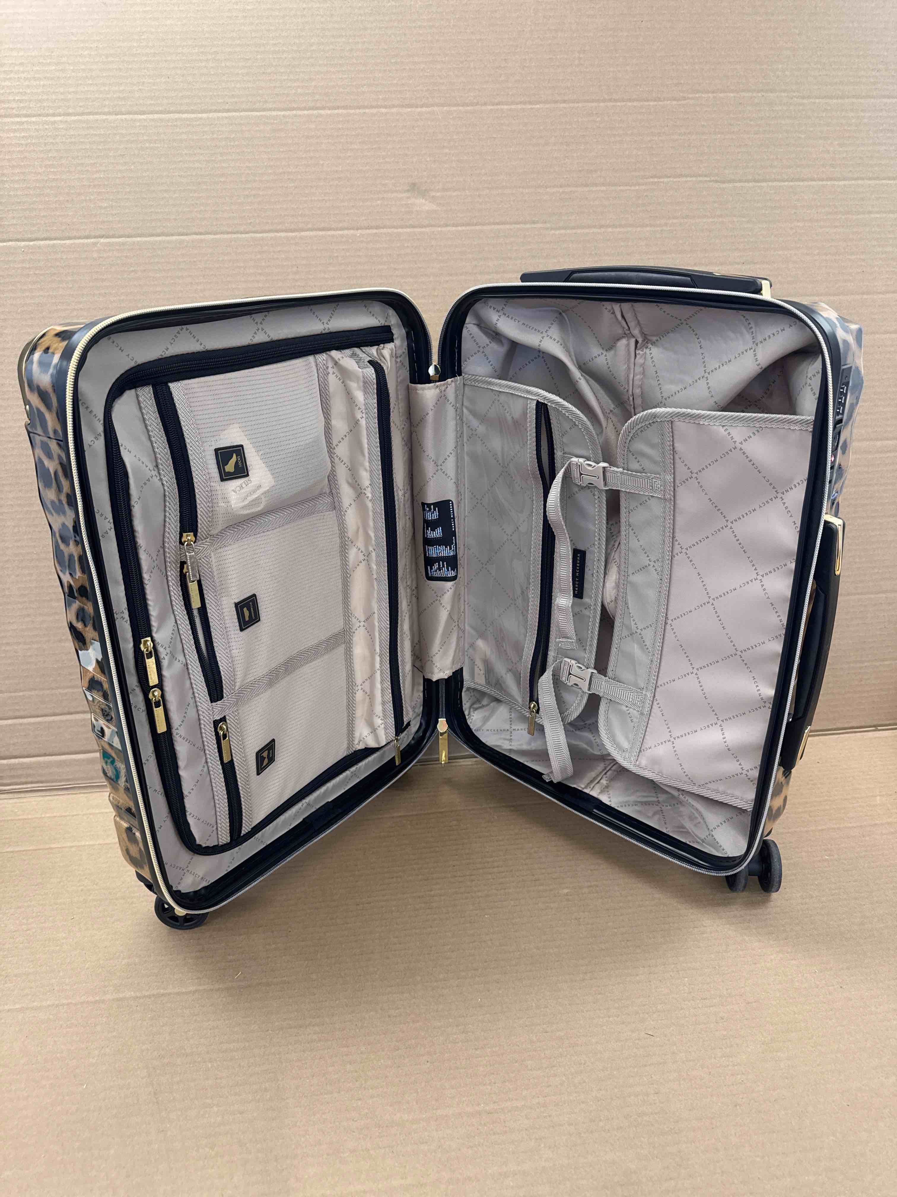 Condition photo showing New/Like New for marcy mckenna hamptons collection milan 22” hardside spinner leopard print 