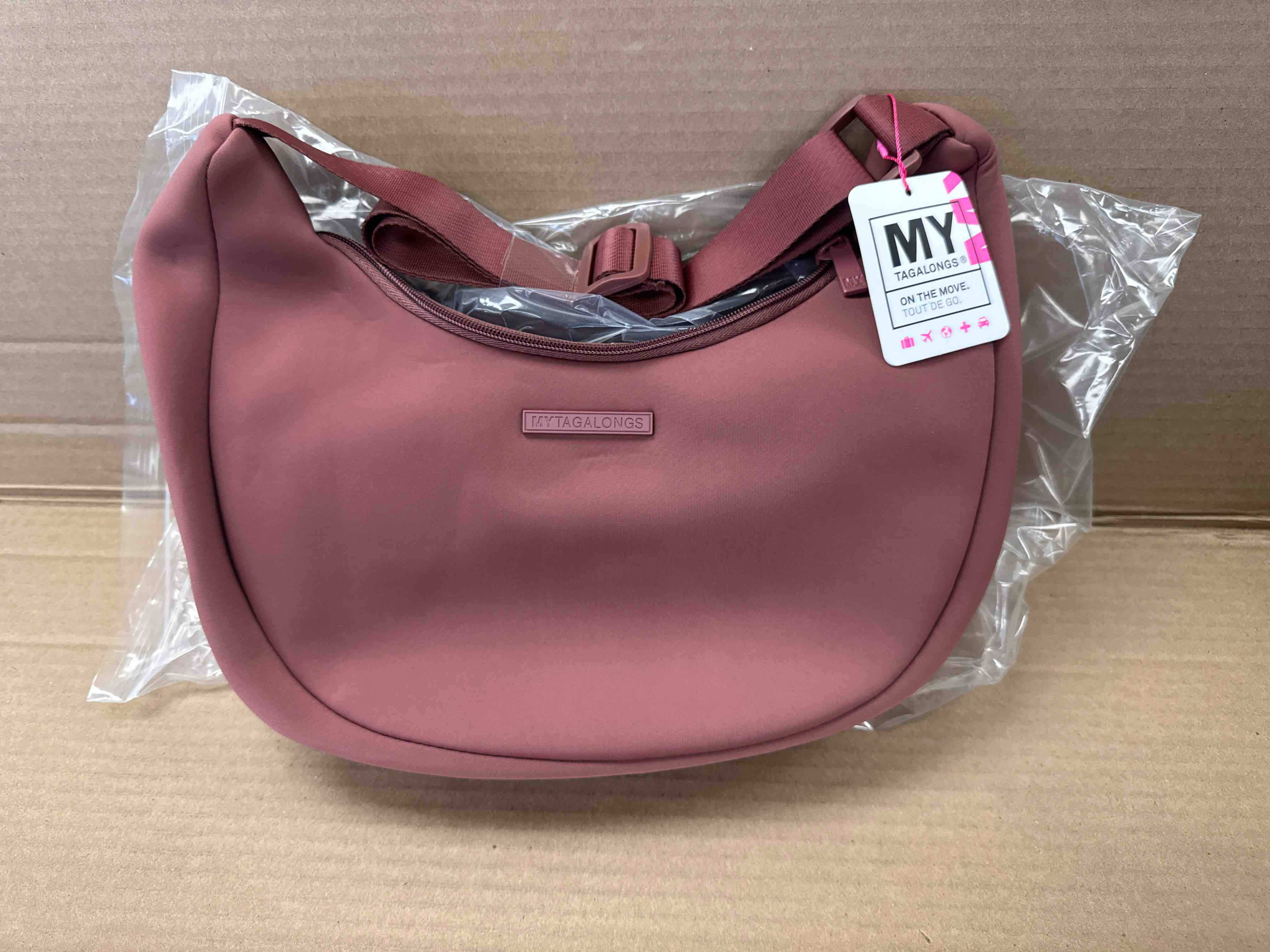 Condition photo showing New/Like New for my tagalongs the crescent crossbody mauve