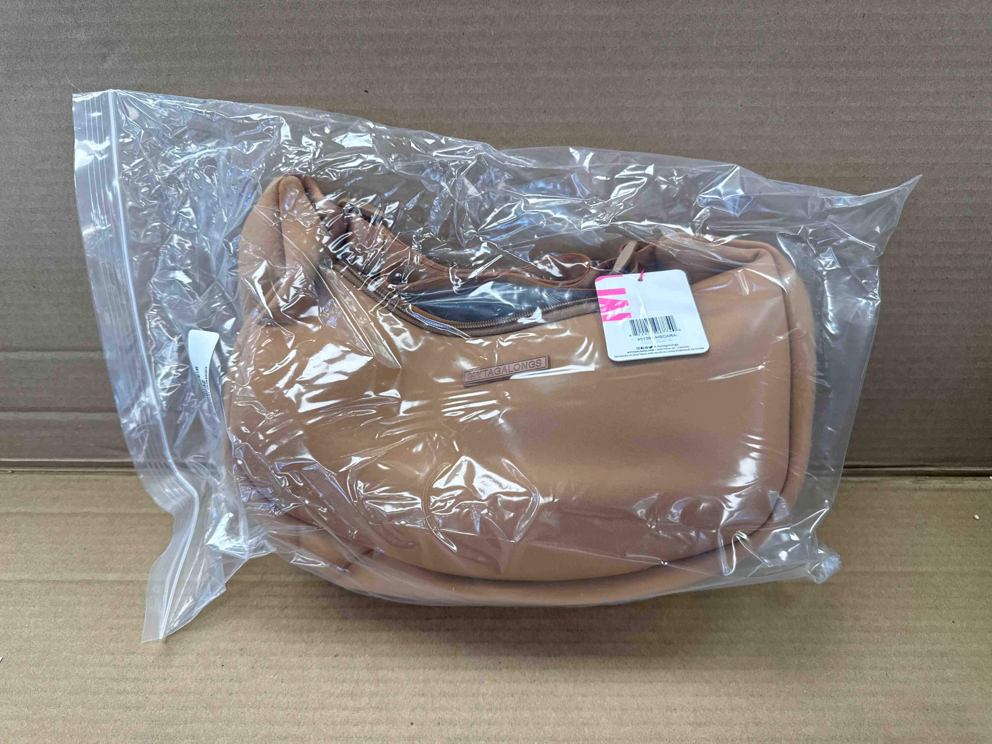 Condition photo showing New/Like New for my tagalongs the crescent crossbody tan