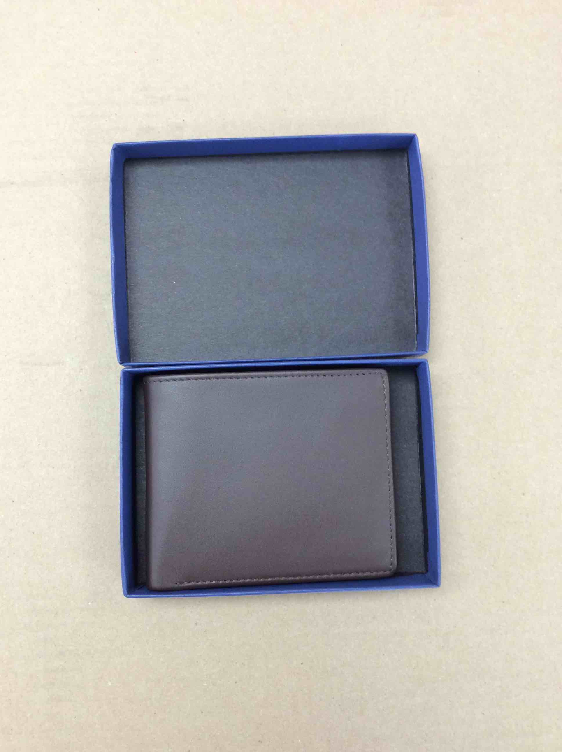 Condition photo showing New/Like New for royce new york leather tri fold wallet 