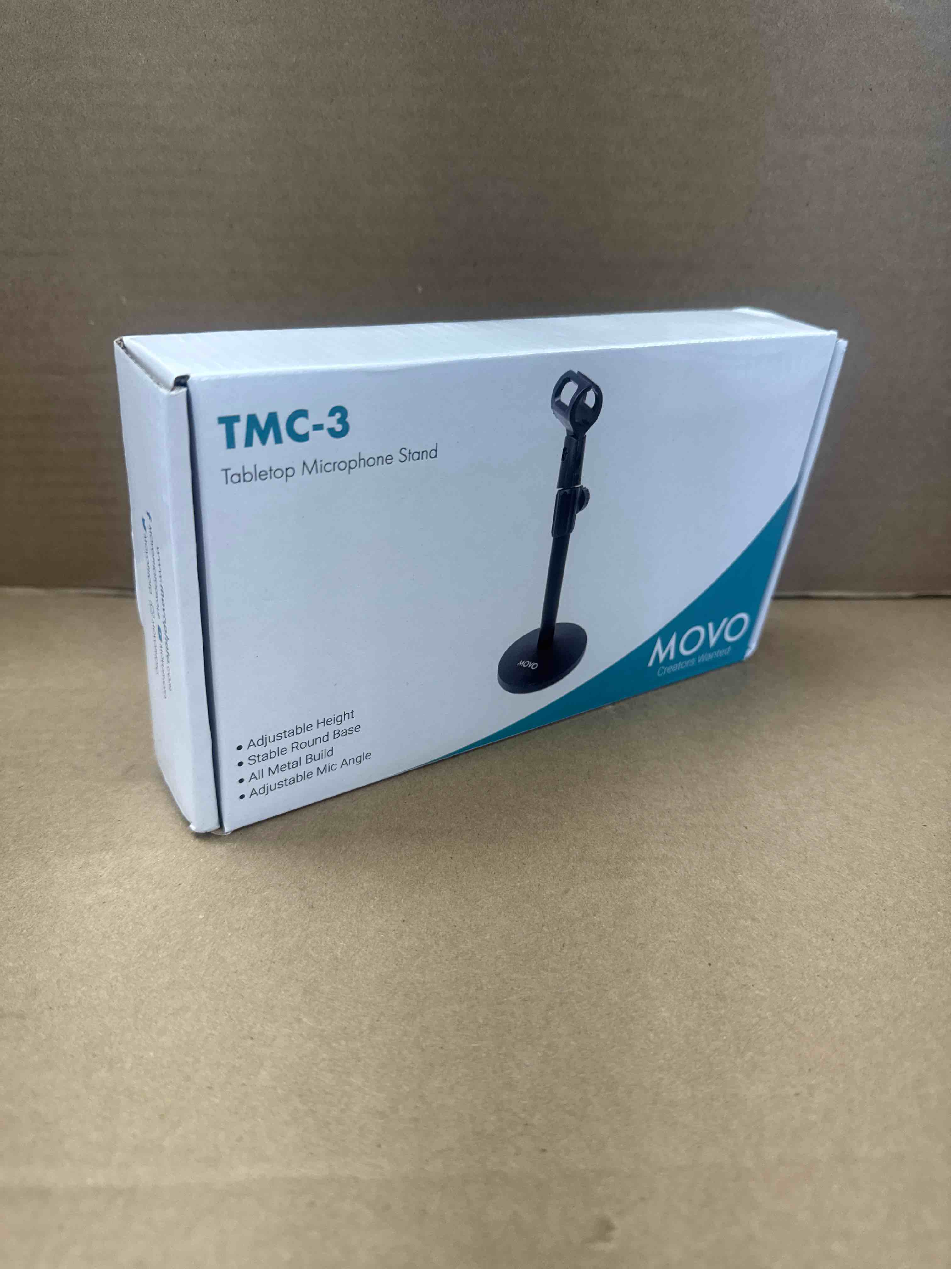 Condition photo showing New/Like New for movo tmc-3 small adjustable table mic stand with round base and universal mic clip. table top mic stand height is adjustable with weighted base sits on desk ideal for podcast, livestream, & interviews