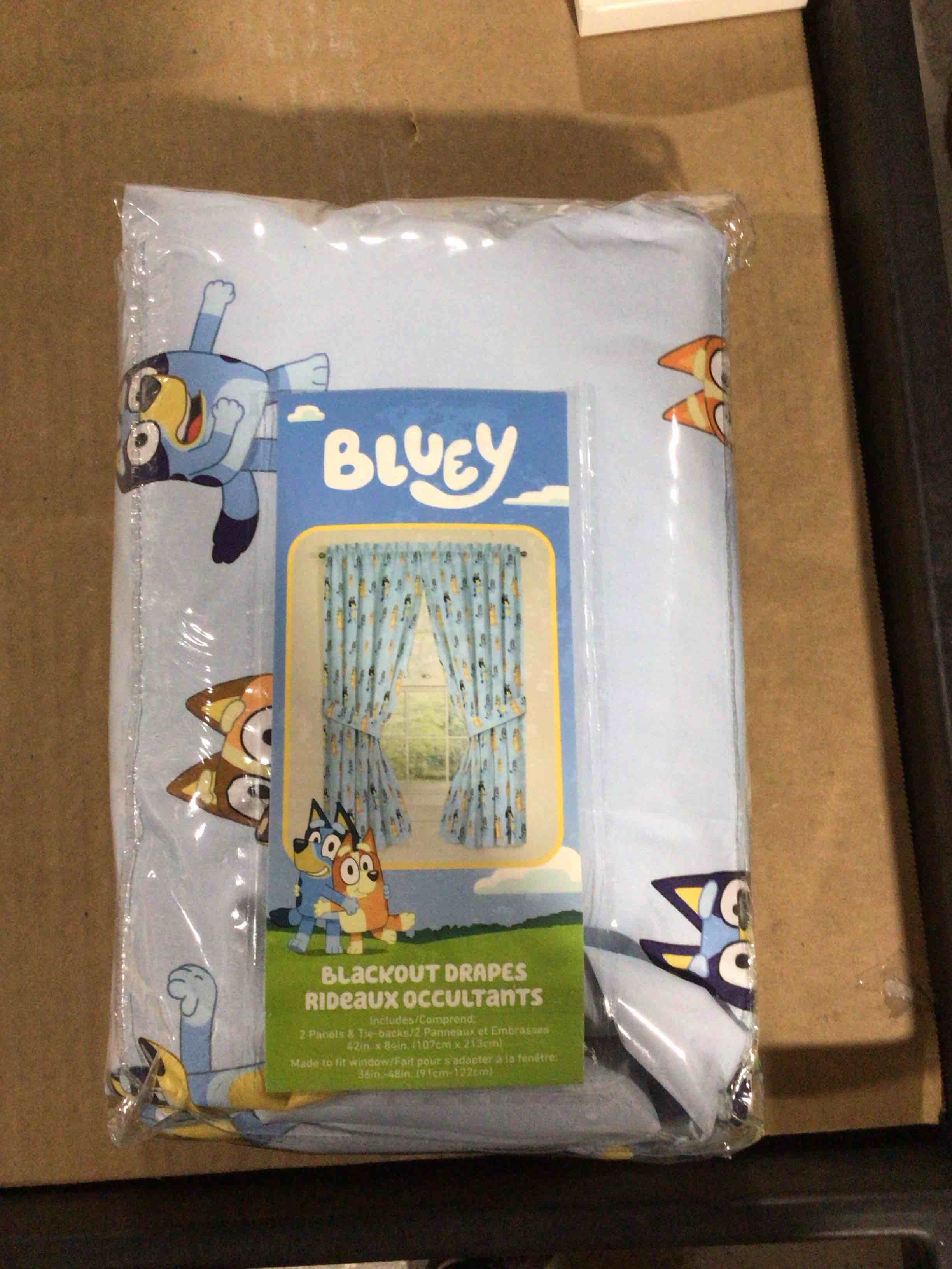Condition photo showing New/Like New for Jay Franco Black Out Window Curtains for Kids Bedroom 4-Piece Drape Set with 2 Tiebacks, Blue - Bluey, 42" W x 84" L (Pack of 2) Blue - Bluey 42"W x 84"L (Pack of 2)