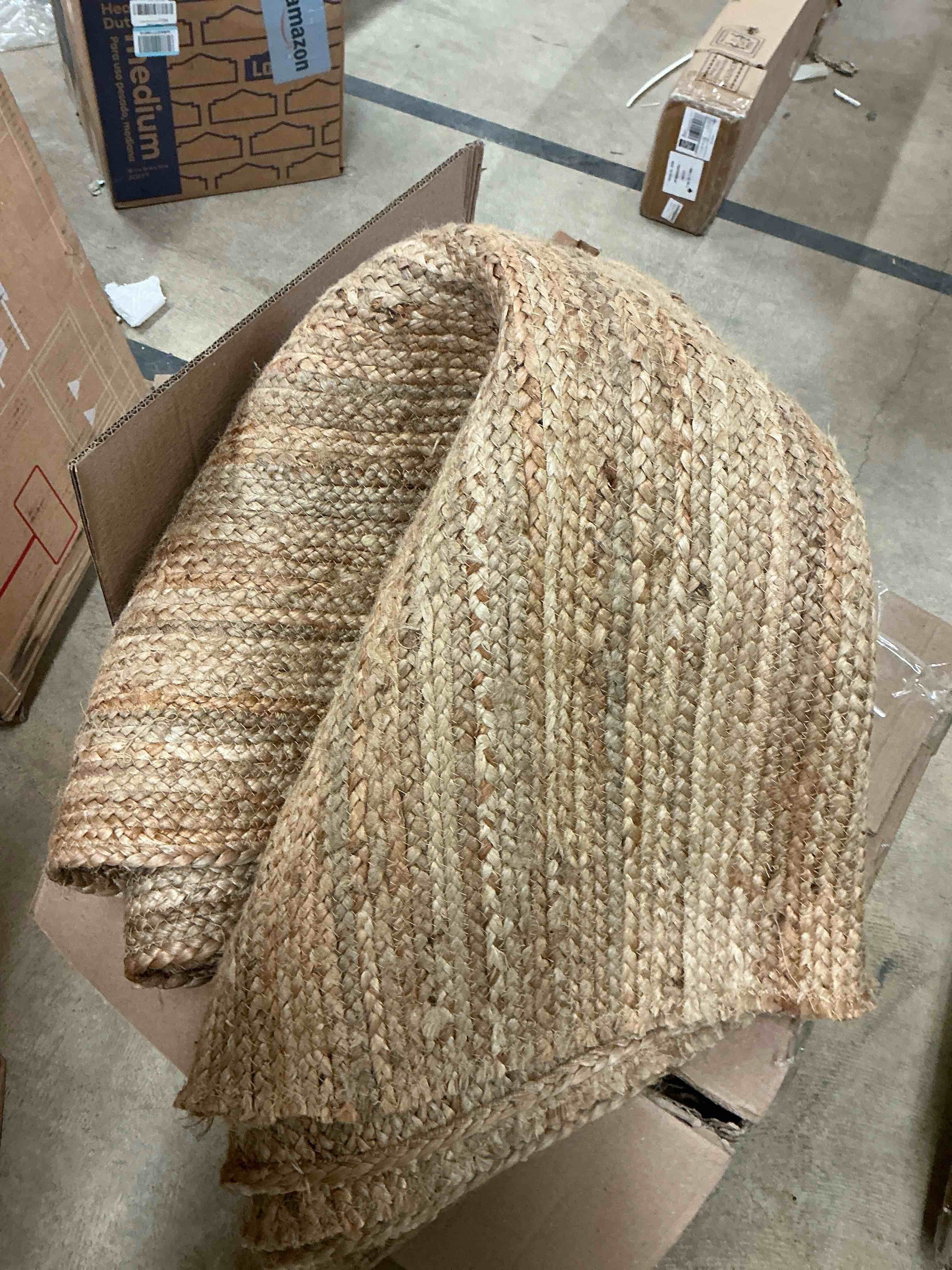Condition photo showing item condition for Hand Braided 8'x10' Jute Area Rug - Premium Eco Friendly Natural Fiber Farmhouse Style Rugs for Living Room, Bedroom, Dinning Room, Hallway, Office