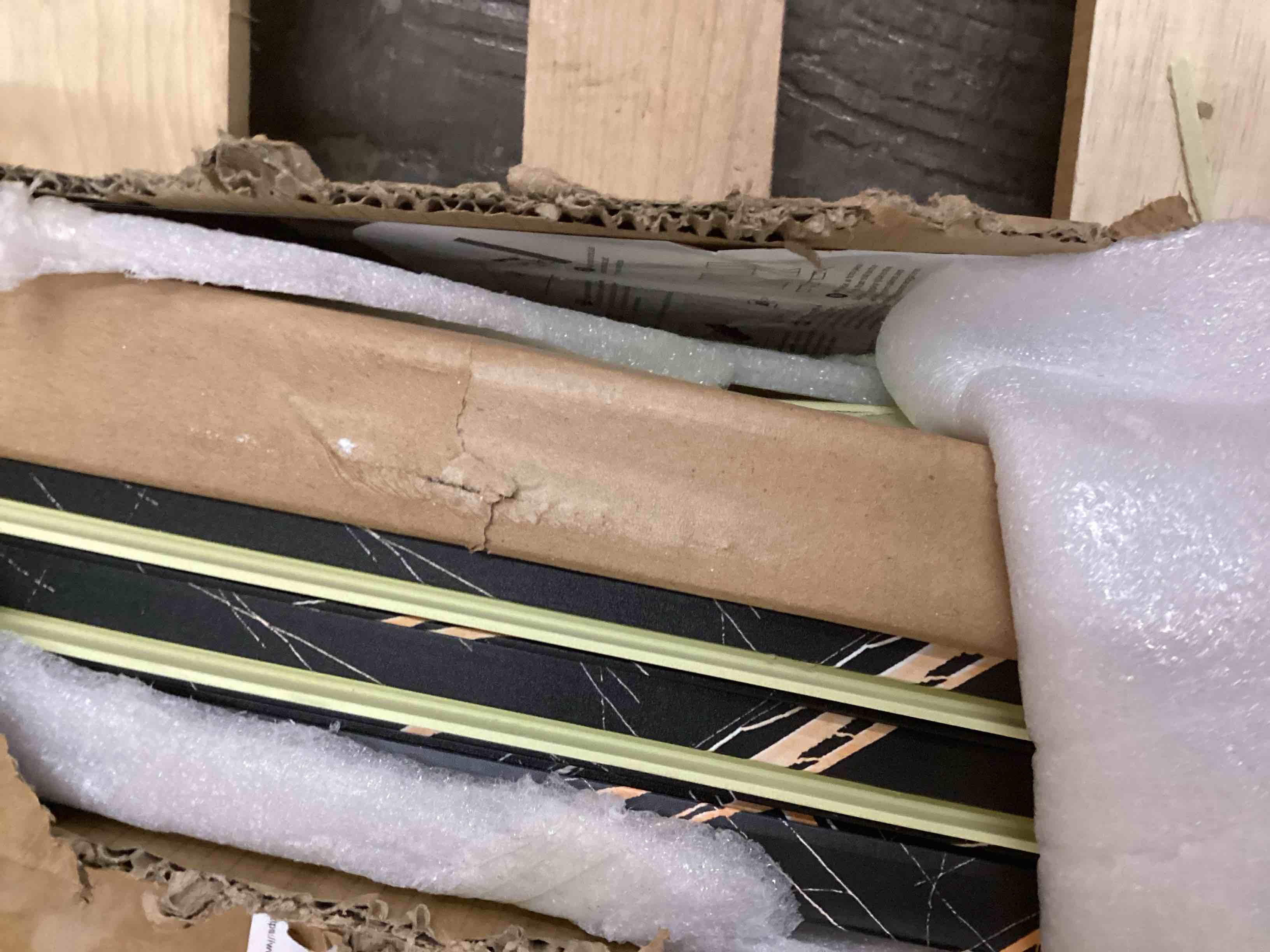 Condition photo showing As Is for OUZUGIE WPC Acoustic Slat Wall Paneling, 8-Pack 114 x 6 Inches 3D Wall Panels for Interior Wall Decor,Living Room,TV Background,Study Room,Office Spaces,Bedroom,High Grille (Black Marble)