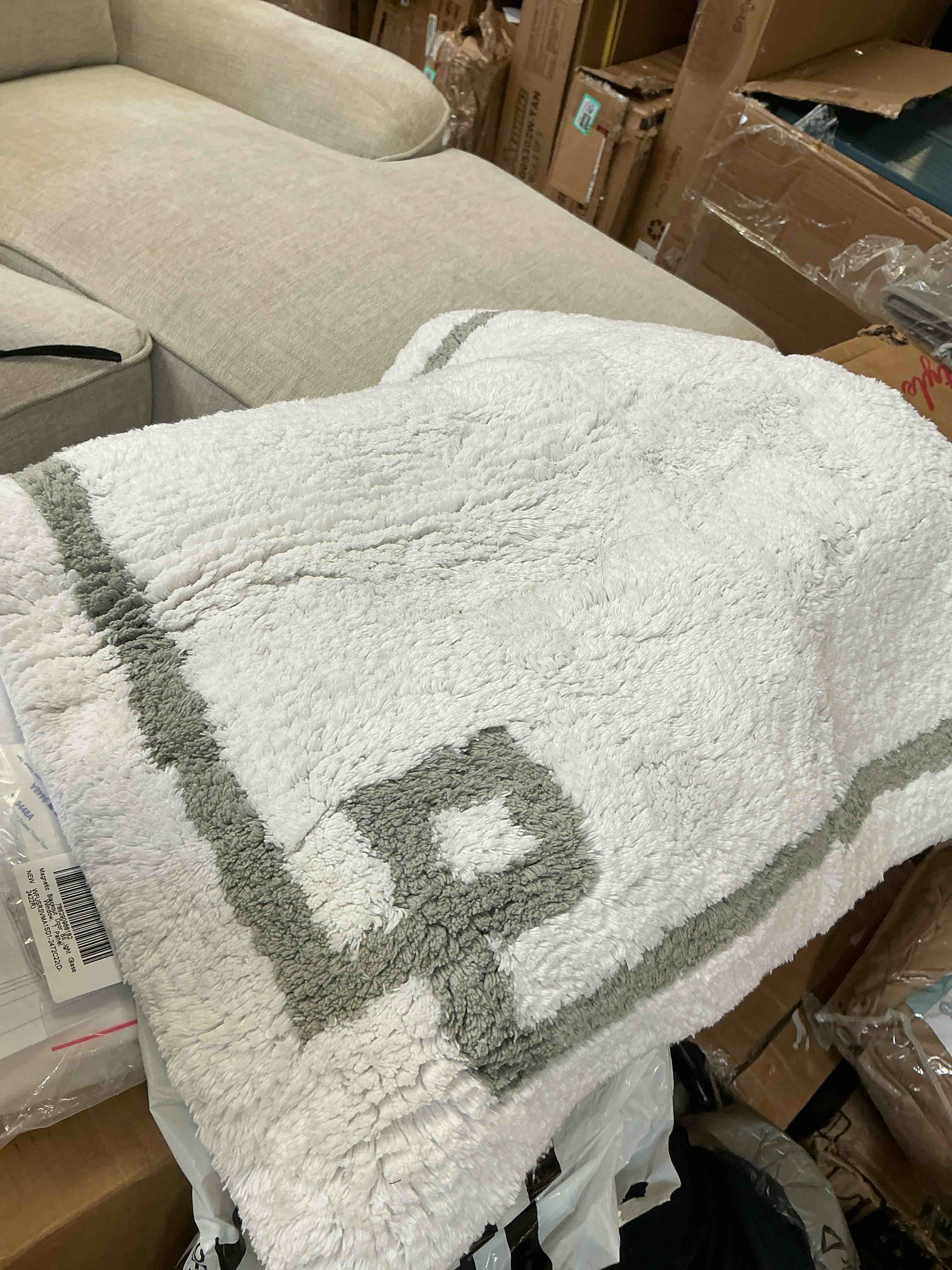 Condition photo showing As Is for cotton tufted bath rug