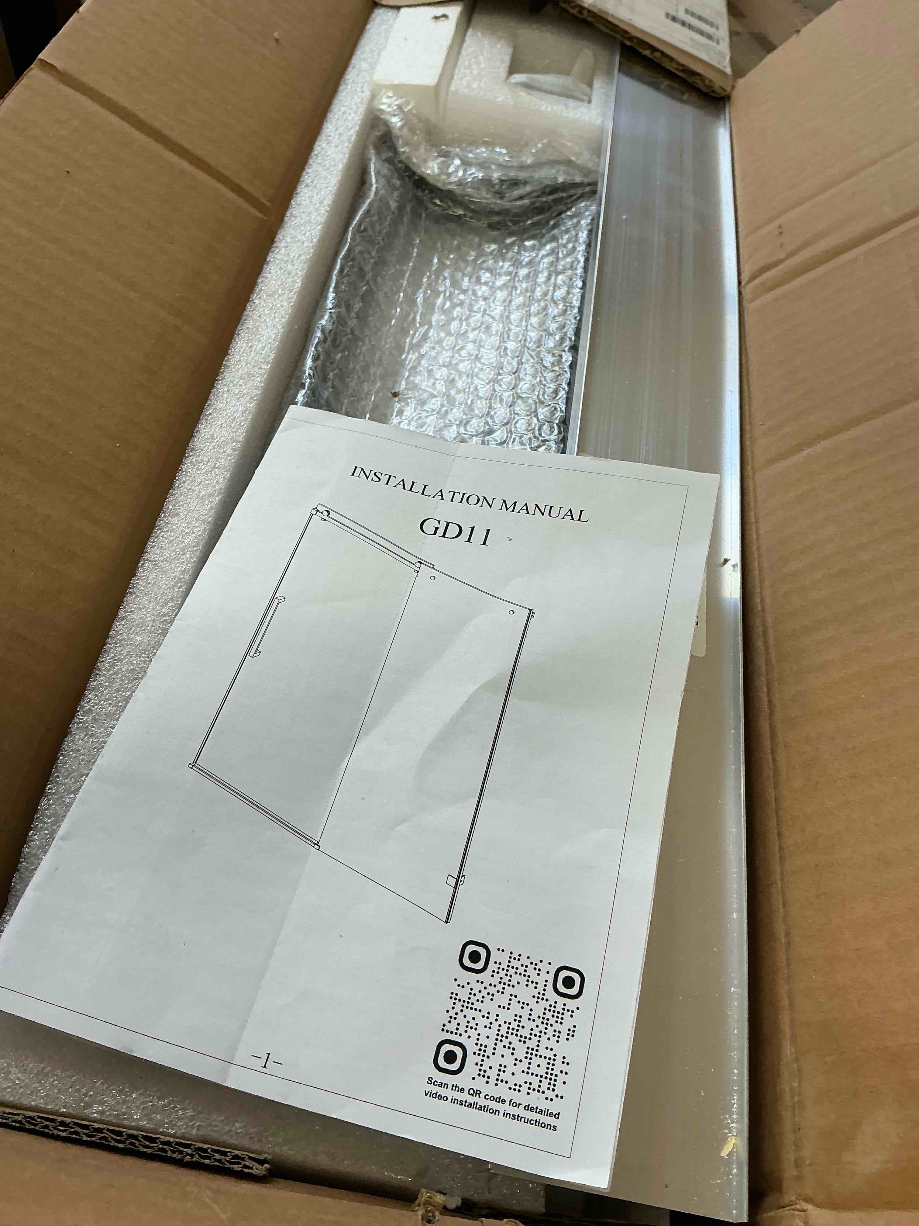 Condition photo showing New/Like New for (does not included glass door) frameless single sliding shower door with clear tempered glass, shatter-resistant film & installation hole locator - square top rail tp-gd11