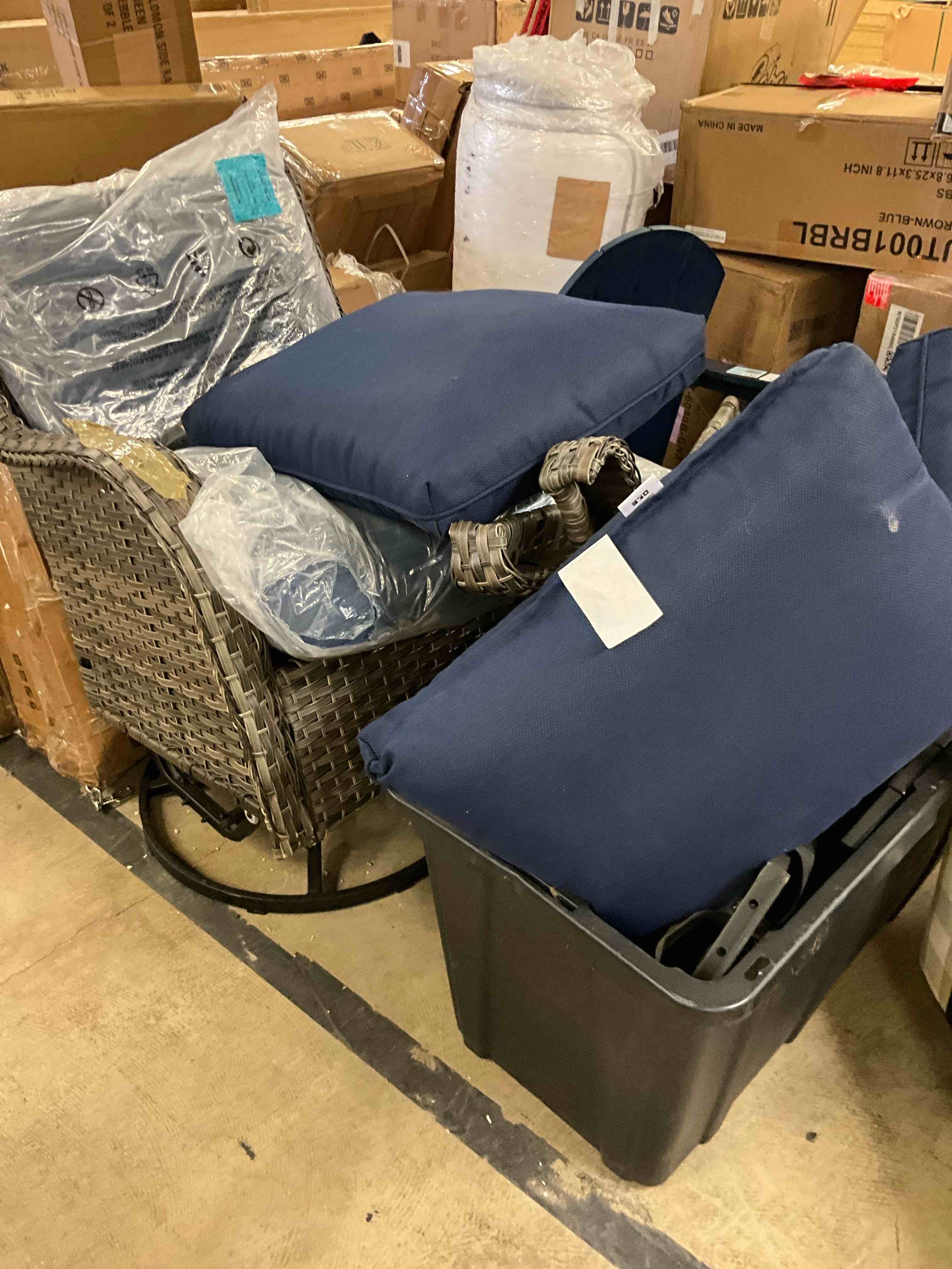 Condition photo showing As Is for wicker gray stainless steel frame swivel glider conversation chair with gray navy cushioned seat set of 2