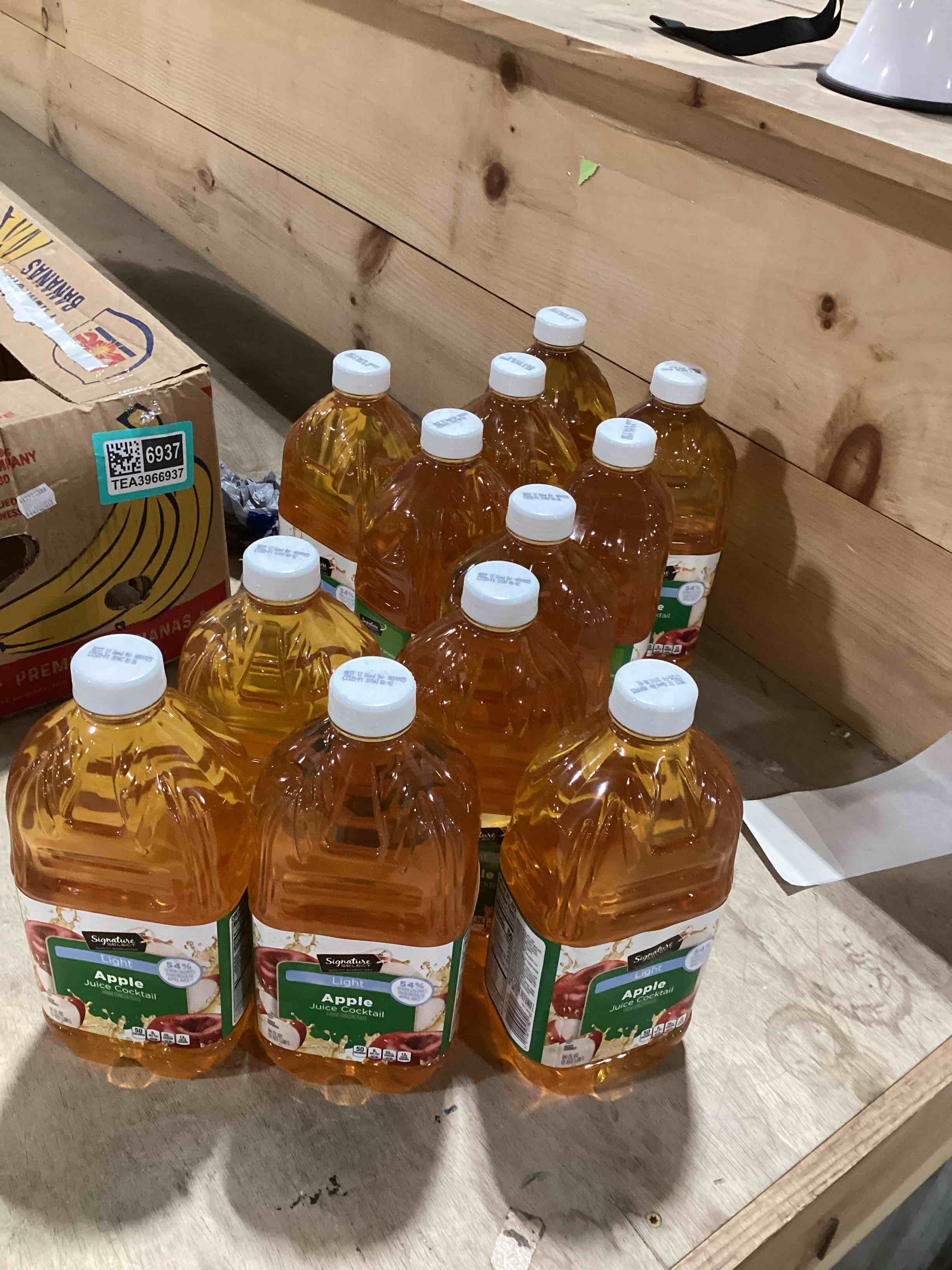 Condition photo showing New/Like New for 12 64oz jugs of signature select apple juice