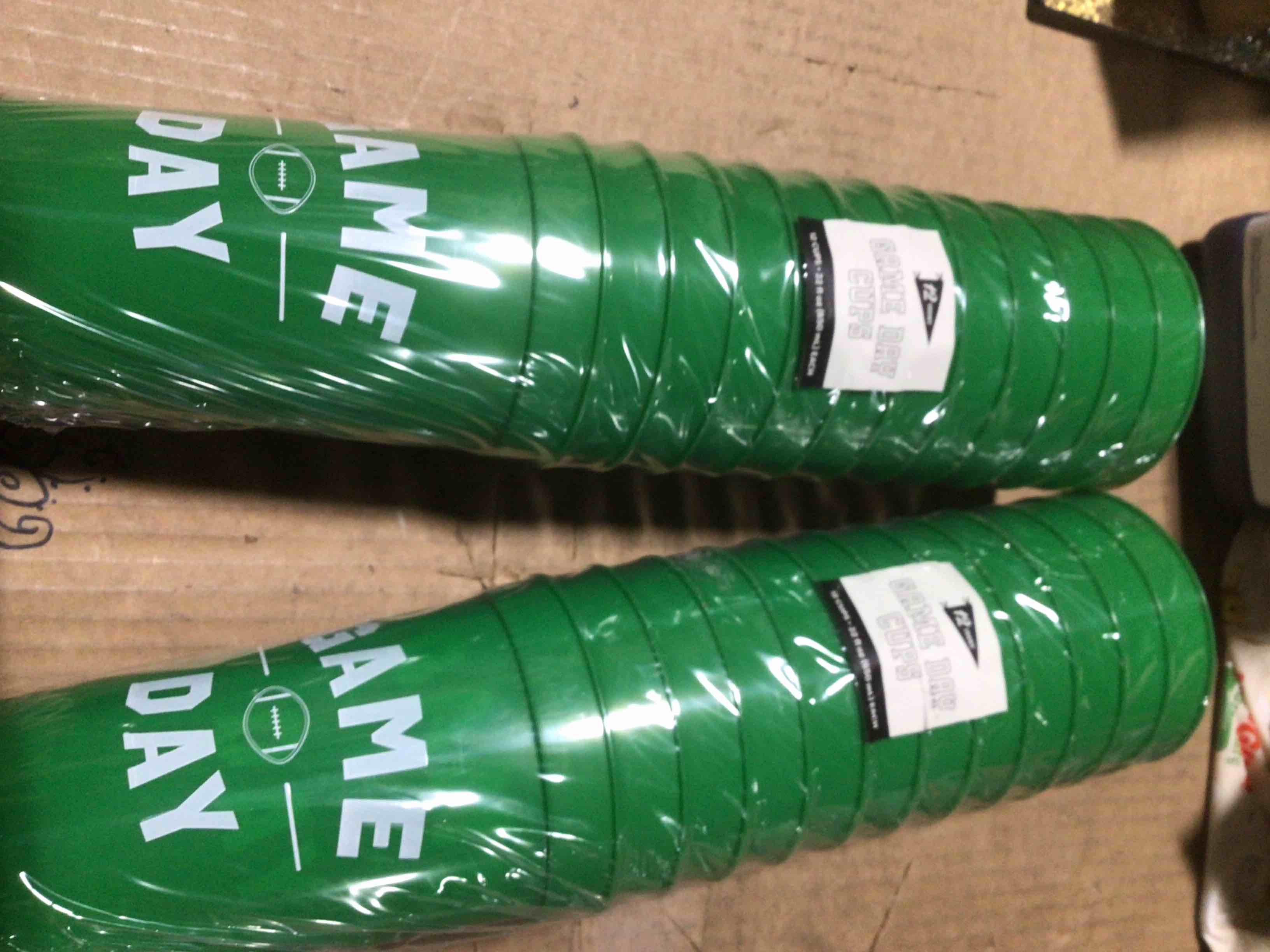 Condition photo showing New/Like New for 12ct “game day” green plastic cups 2 packs